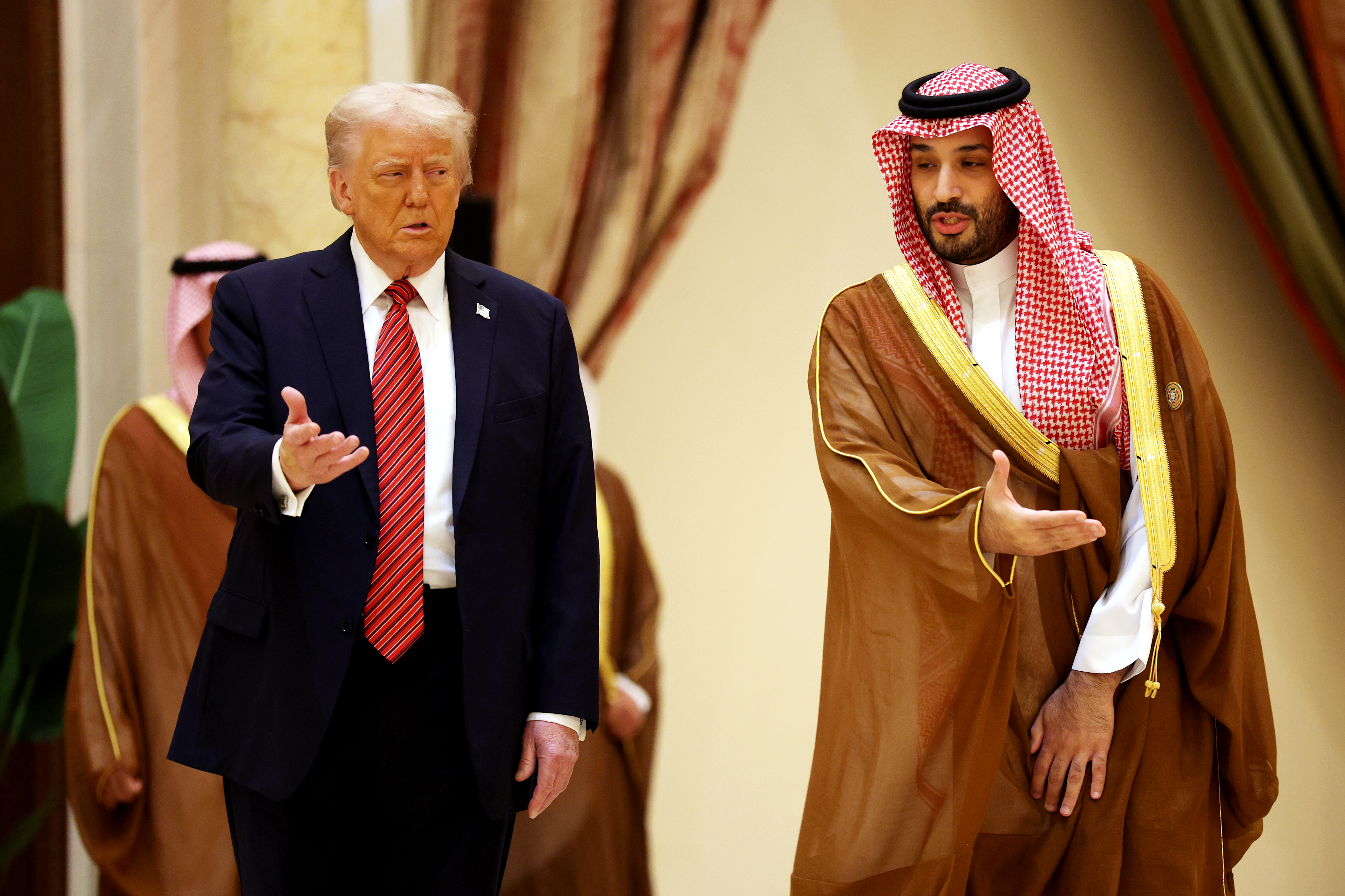 RIYADH, SAUDI ARABIA - MAY 14: U.S. President Donald Trump and Saudi Crown Prince Mohammed bin Salman speak as they arrive during the Gulf Cooperation Council (GCC) Leaders’ Summit at The Ritz-Carlton on May 14, 2025 in Riyadh, Saudi Arabia. The council addresses regional stability, defense cooperation, and energy policy among Gulf nations. Trump is on a multi-nation tour of the Gulf region focused on expanding economic ties and reinforcing security cooperation with key U.S. allies. (Photo by Win McNamee/Getty Images)