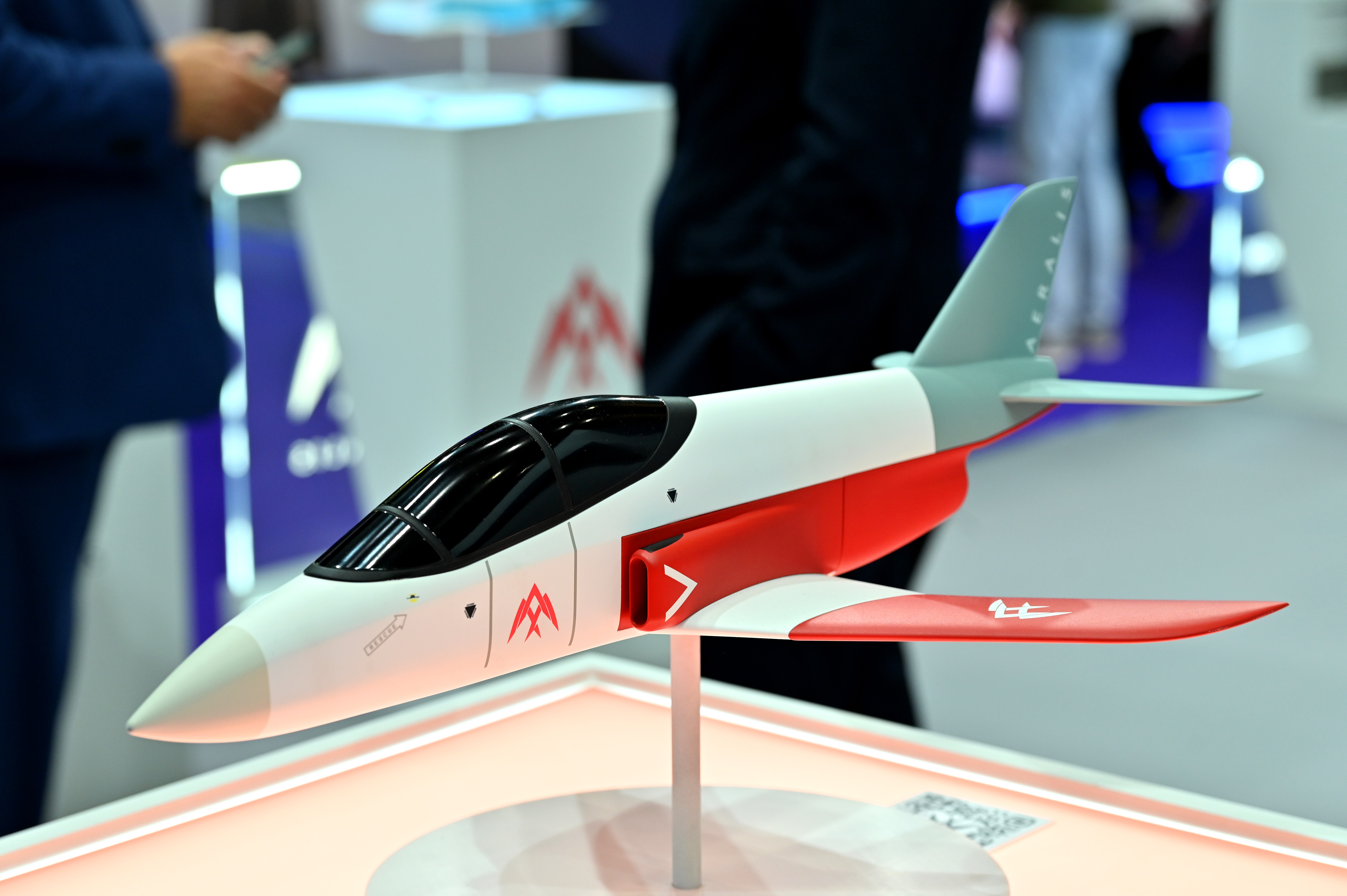 LONDON, ENGLAND - SEPTEMBER 09: A model of a Aeralis Aggressor Red Air Surrogate aircraft is displayed during the Security Equipment International (DSEI) at London Excel on September 09, 2025 in London, England. The Defence and Security Equipment International (DSEI) hosts defence equipment manufacturers from around the world at a 4-day exhibition in London. Anti-war protesters gather outside in the hope of preventing the event from going ahead. (Photo by John Keeble/Getty Images)