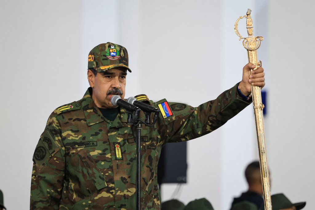 CARACAS, VENEZUELA - NOVEMBER 25: President of Venezuela Nicolás Maduro delivers a speech while holding the Venezuelan independence hero Simon Bolivar's 'Sword of Peru' during a military ceremony on November 25, 2025, in Caracas, Venezuela. The United States recently designated the "Cartel De Los Soles" (Cartel of The Suns) as a foreign terrorist organization, a group allegedly led by the president of Venezuela, Nicolas Maduro, and which, it is presumed, includes high-ranking members of the Venezuelan government. (Photo by Jesus Vargas/Getty Images)