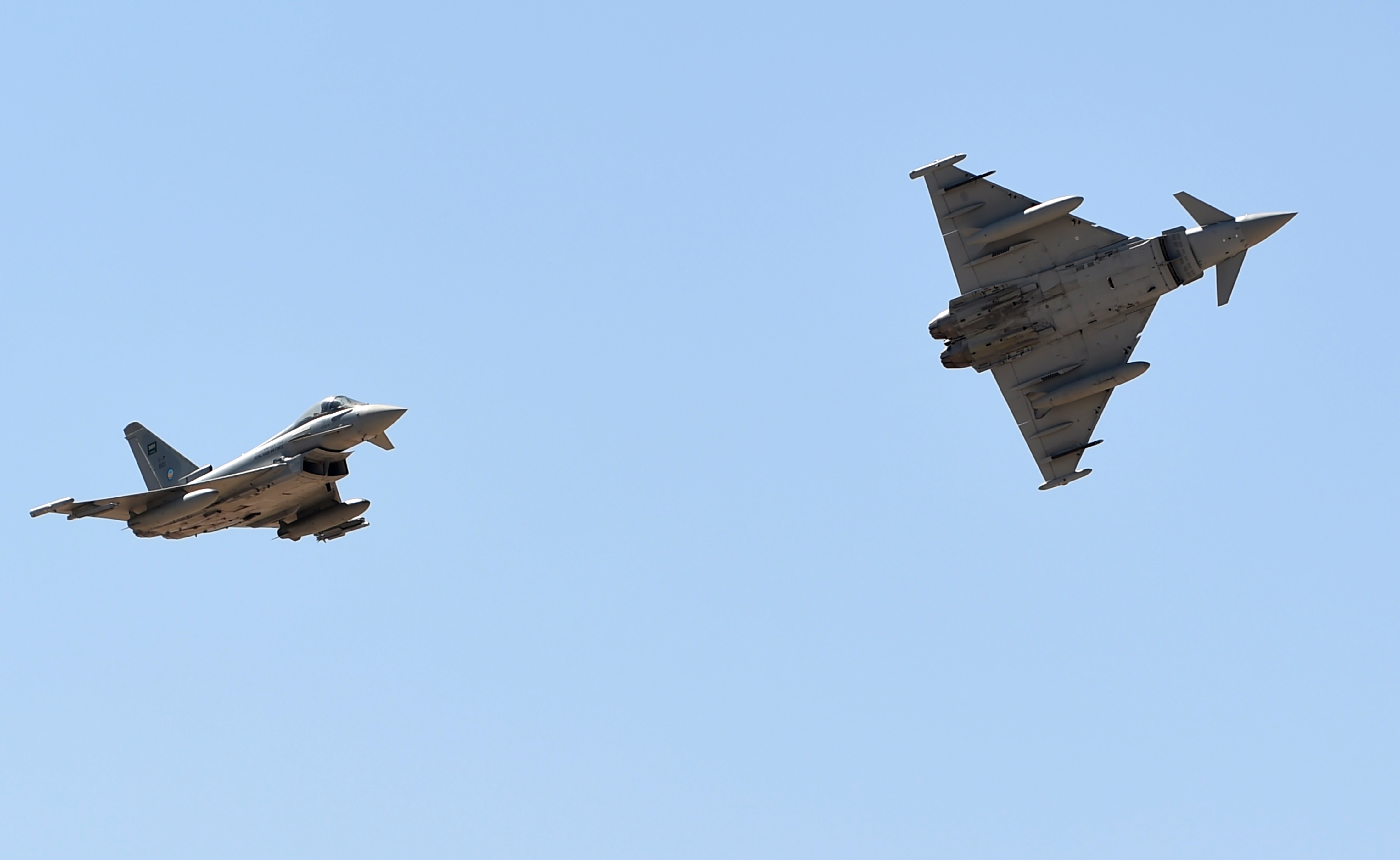 Saudi Air Force Eurofighter Typhoon fighter jets perform during a ceremony marking the 50th anniversary of the creation of the King Faisal Air Academy at King Salman airbase in Riyadh on January 25, 2017. / AFP / FAYEZ NURELDINE (Photo credit should read FAYEZ NURELDINE/AFP via Getty Images)