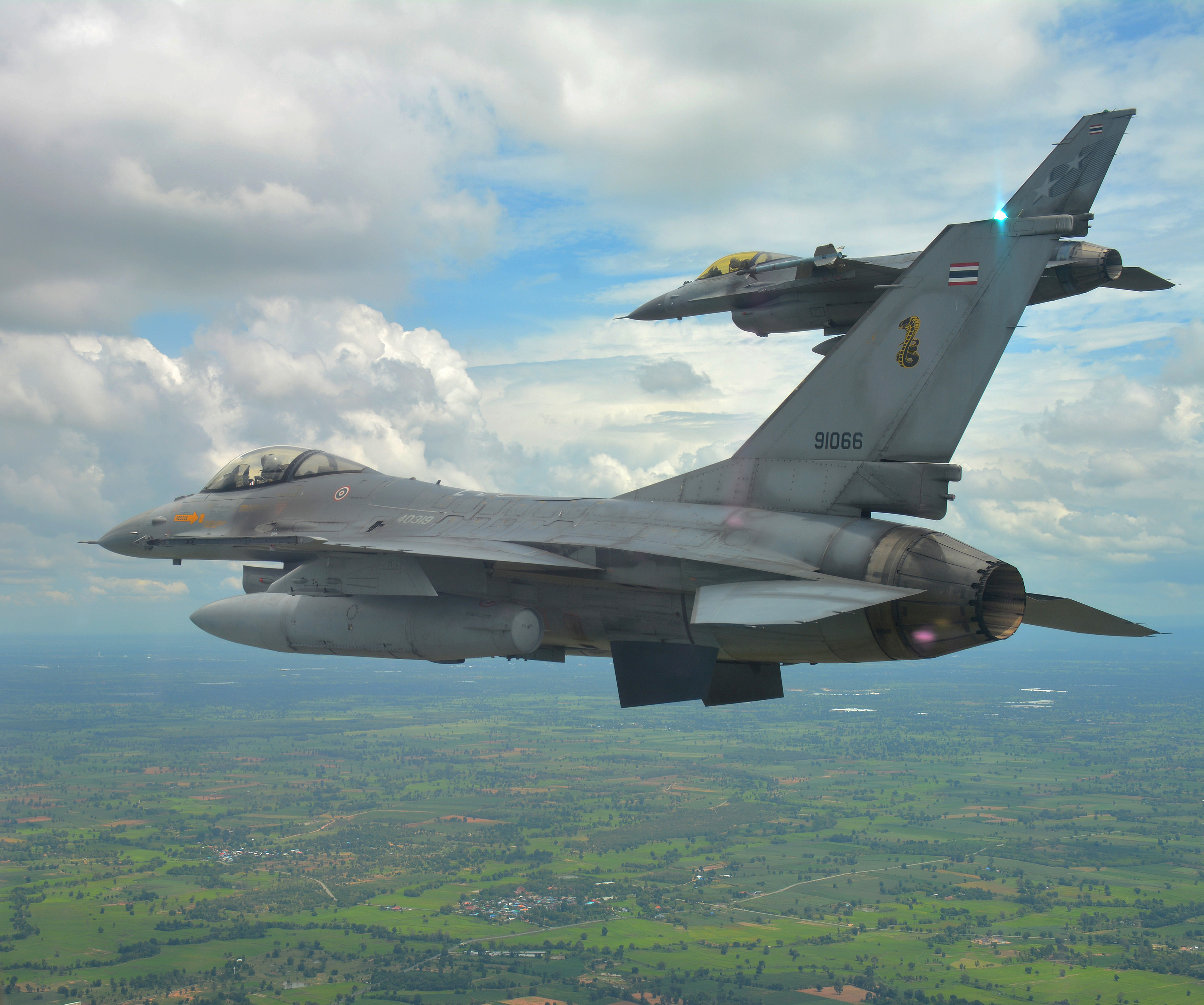 A pair of F-16s from the Royal Thai Air Force, fly in formation during Exercise Thai Boomerang 2019. *** Local Caption *** No. 1 Squadron (1SQN) is participating in Exercise Thai Boomerang 2019, a bi-lateral fighter exercise between the Royal Thai Air Force and the Royal Australian Air Force at Korat Air Base, Thailand. The exercise will expose 1SQN to Dissimilar Air Combat Training and Large Force Employment operations in the South East area of operations, and further enhance the relationship between Australia and Thailand.