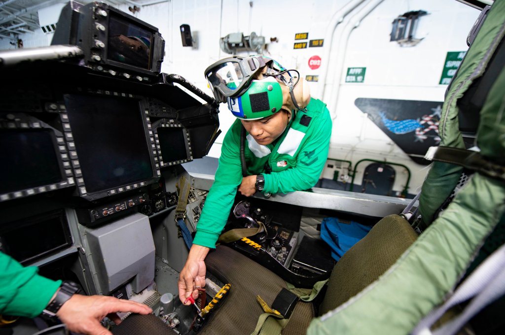 190413-N-ON904-122 ATLANTIC OCEAN (April 13, 2019) Aviation Structural Mechanic (Equipment) 3rd Class Jay Andrada, from Ilocos Norte, Phillipines, checks the ejection safety pin on a seat in an F/A-18F Super Hornet, assigned to the "Fighting Swordsmen" of Strike Fighter Squadron (VFA) 32, in the hangar bay aboard the aircraft carrier USS Dwight D. Eisenhower (CVN 69). Ike is underway conducting flight deck certification during the basic phase of the Optimized Fleet Response Plan (OFRP). (U.S. Navy photo by Mass Communication Specialist 3rd Class Ashley M.C. Estrella)