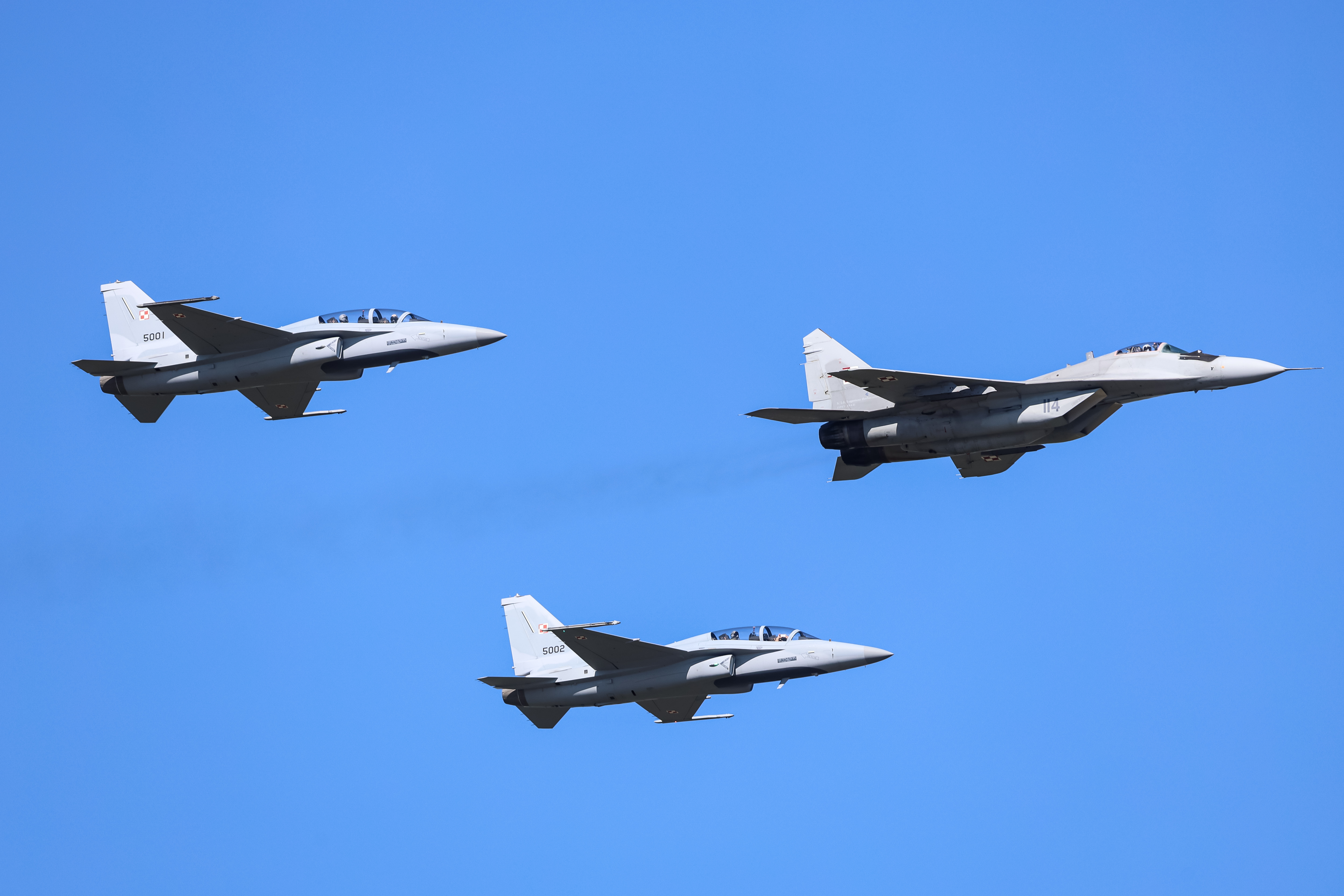 Polish Air force presents MIG-29 and FA-50 aircraft during military parade Strong White and Red (colours of Polish national flag) to celebrate Polish Army Day on Wislostrada Street in the centre of Warsaw, the capital of Poland on August 15, 2023. It is the biggest presentation of arms in Poland since years and provides an opportunity to communicate to Russian Federation, the defence abilities of Poland. (Photo by Dominika Zarzycka/NurPhoto via Getty Images)