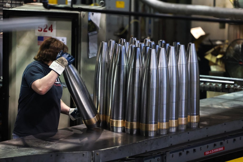 TOPSHOT - An employee handles 155 mm caliber shells after the manufacturing process at the Scranton Army Ammunition Plant (SCAAP) in Scranton, Pennsylvania on April 16, 2024. In brick buildings that are more than a century old, nearly in the heart of Joe Biden's Rust Belt hometown of Scranton, Pennsylvania, dated machinery churns artillery for modern conflicts, especially the war in Ukraine. The Scranton Army Ammunition Plant (SCAAP) is making steel tubes for 155 mm caliber shells, which are crucial to Kyiv's efforts to face down Moscow's invasion. (Photo by Charly TRIBALLEAU / AFP) (Photo by CHARLY TRIBALLEAU/AFP via Getty Images)