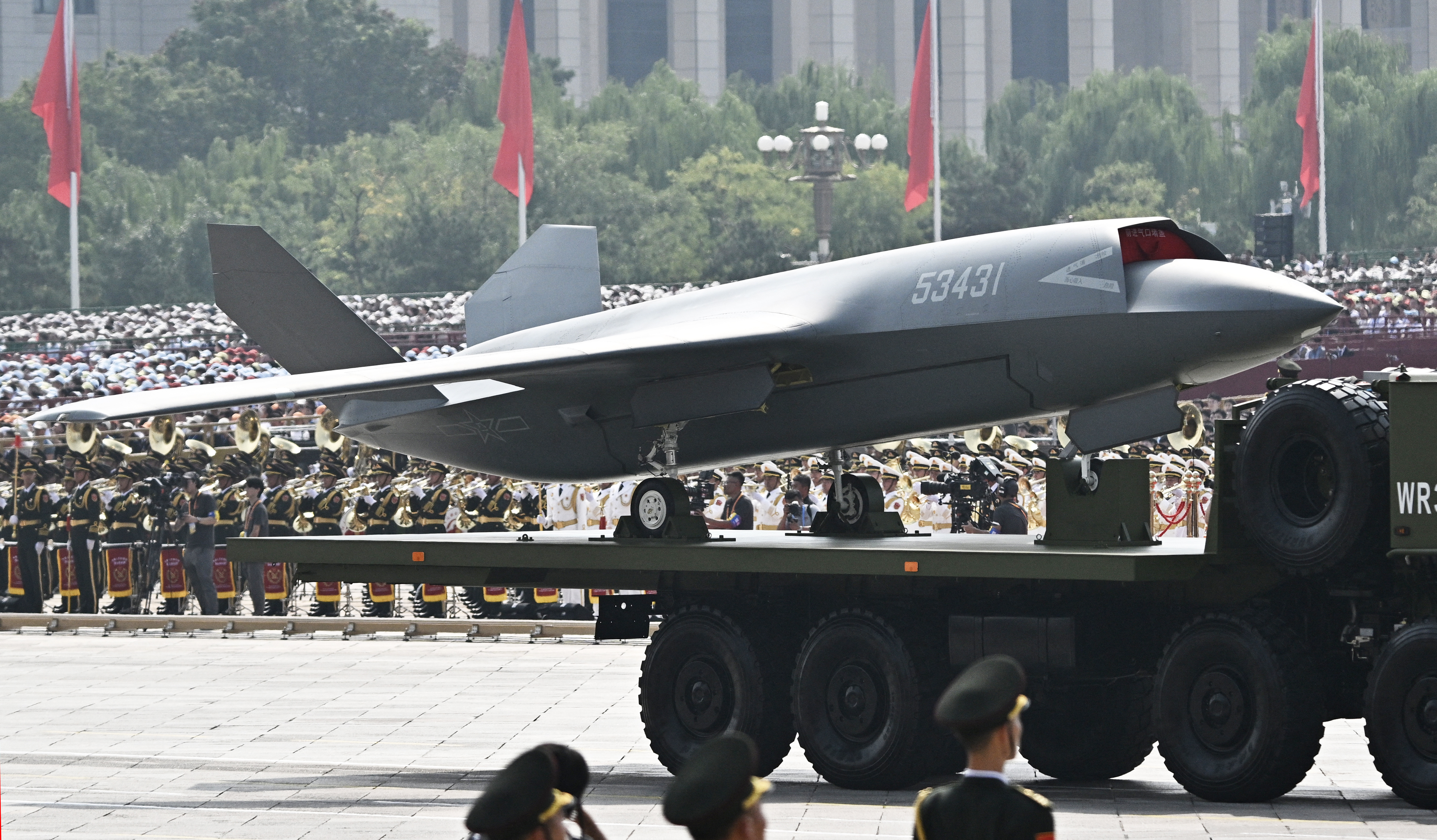 An unmanned aerial vehicle is seen during a military parade marking the 80th anniversary of victory over Japan and the end of World War II, in Beijing's Tiananmen Square on September 3, 2025. (Photo by Pedro PARDO / AFP) (Photo by PEDRO PARDO/AFP via Getty Images)