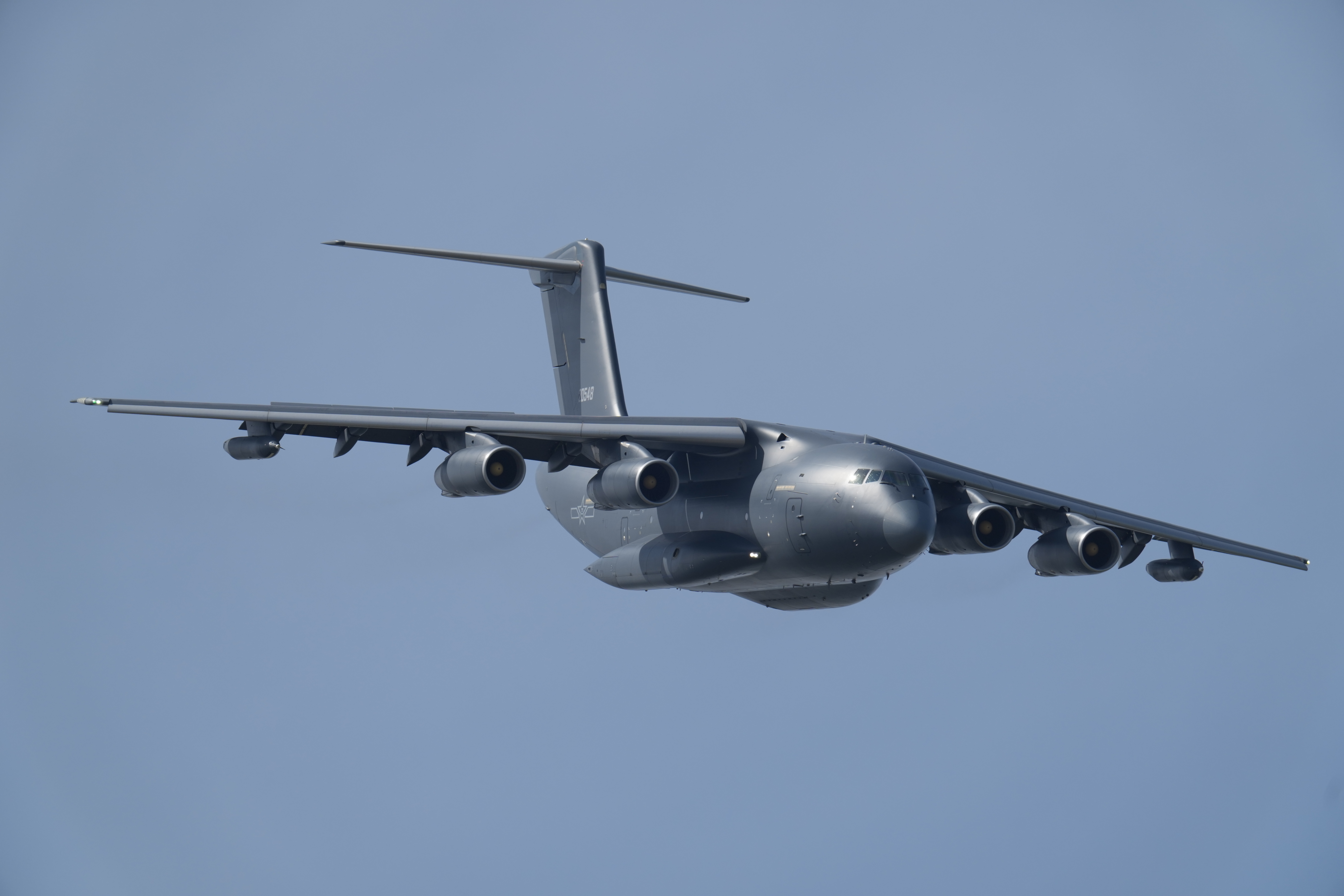 CHANGCHUN, CHINA - SEPTEMBER 19: Y-20 military transport aircraft flies in the sky during flight performance at the aviation open-day activities of the Chinese People's Liberation Army Air Force (PLAAF) and the Changchun Air Show 2025 on September 19, 2025 in Changchun, Jilin Province of China. The event will be held from September 19 to 23 in Changchun. (Photo by Yue Shuhua/VCG via Getty Images)