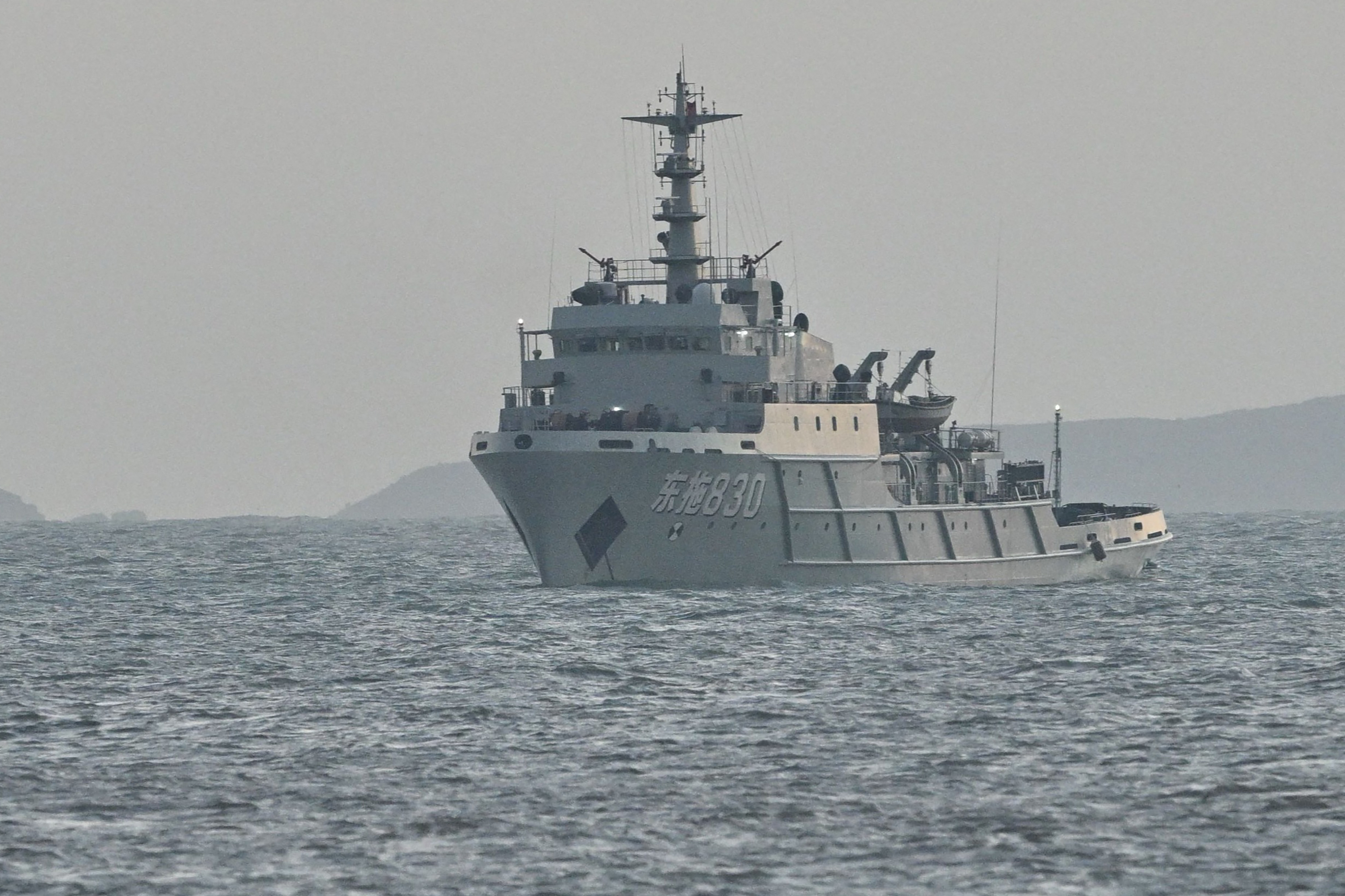 A Chinese ship is seen in waters near Pingtan island, the closest point to Taiwan, in eastern China's Fujian province on December 29, 2025. China launched live-fire drills around Taiwan on December 29 that it said would simulate a blockade of the self-ruled island's key ports, prompting Taipei to condemn Beijing's "military intimidation". (Photo by ADEK BERRY / AFP via Getty Images)