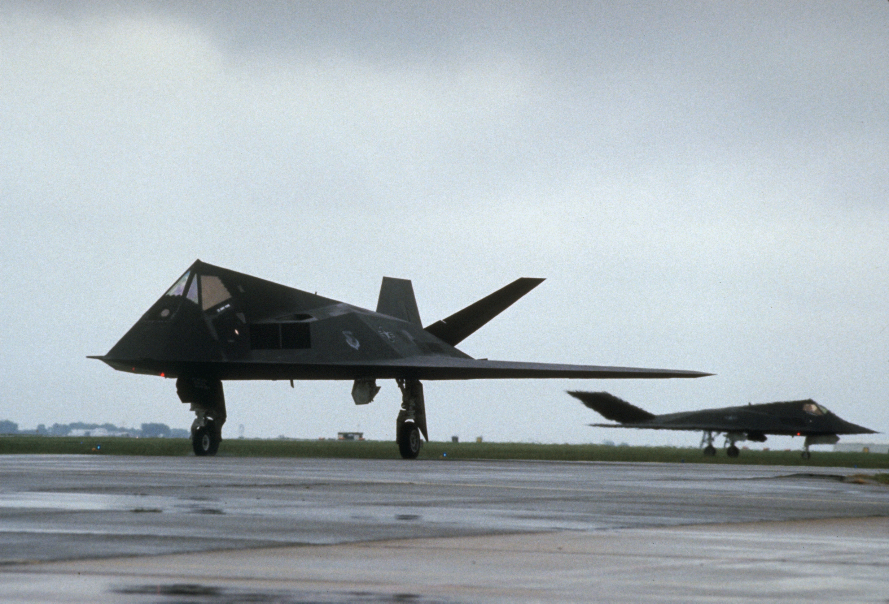 Two 37th Tactical Fighter Wing F-117A aircraft taxi into takeoff position. The 37th TFW is preparing to deploy to Saudi Arabia for Operation Desert Shield. (Photo by © CORBIS/Corbis via Getty Images)