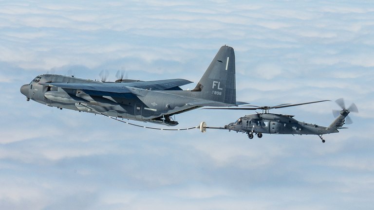 U.S. Air Force HH-60W Jolly Green II helicopters, assigned to the 943d Rescue Group, conduct helicopter air-to-air refueling with an HC-130J Combat King II aircraft,
