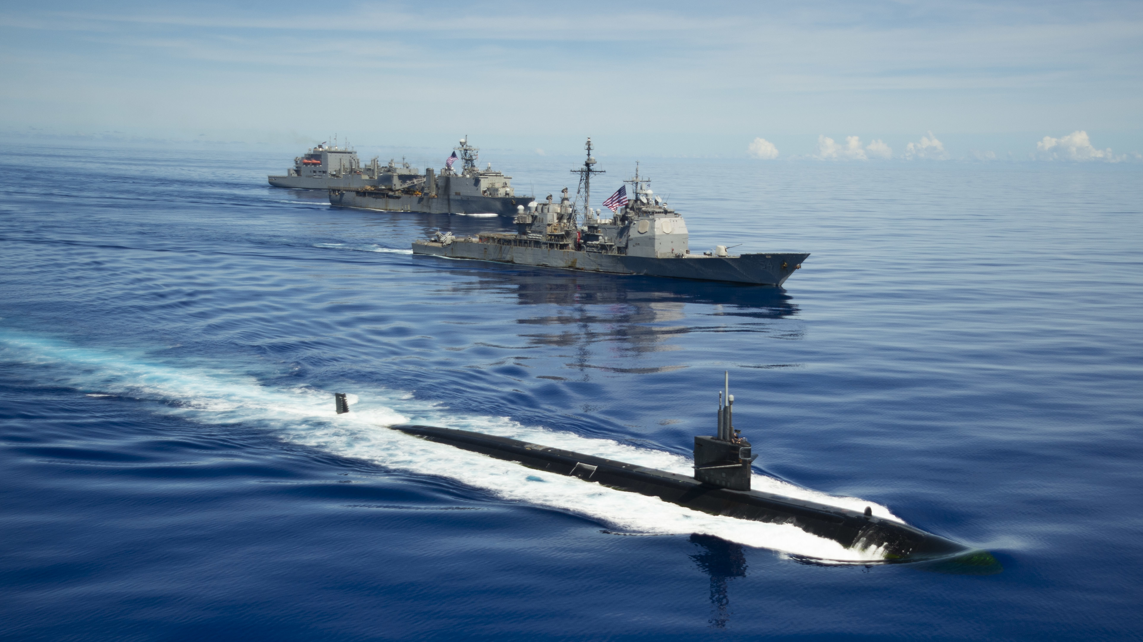 200925-N-KP021-0289 PHILIPPINE SEA (Sept. 25, 2020) From right, USS Chicago (SSN 721), USS Antietam (CG 54), USS Germantown (LSD 42) and USNS Sacagawea (T-AKE 2) steam in formation in support of Valiant Shield 2020. Valiant Shield is a U.S. only, biennial field training exercise (FTX) with a focus on integration of joint training in a blue-water environment among U.S. forces. This training enables real-world proficiency in sustaining joint forces through detecting, locating, tracking and engaging units at sea, in the air, on land and in cyberspace in response to a range of mission areas. (U.S. Navy photo by Mass Communication Specialist 2nd Class Codie L. Soule)