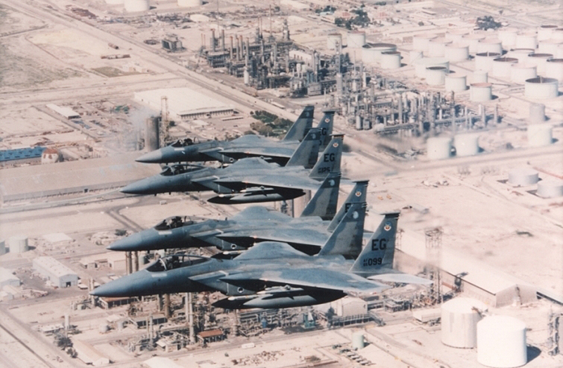 In this historic photo, a four-ship of F-15C Eagles, deployed from Eglin Air Force Base, fly over the Persian Gulf in the 1990s. The then-named 33rd Tactical Fighter Wing, flew combat air patrol and high value airbourne asset protection missions as part of Operations Desert Storm and Southern Watch. (Courtesy photo)