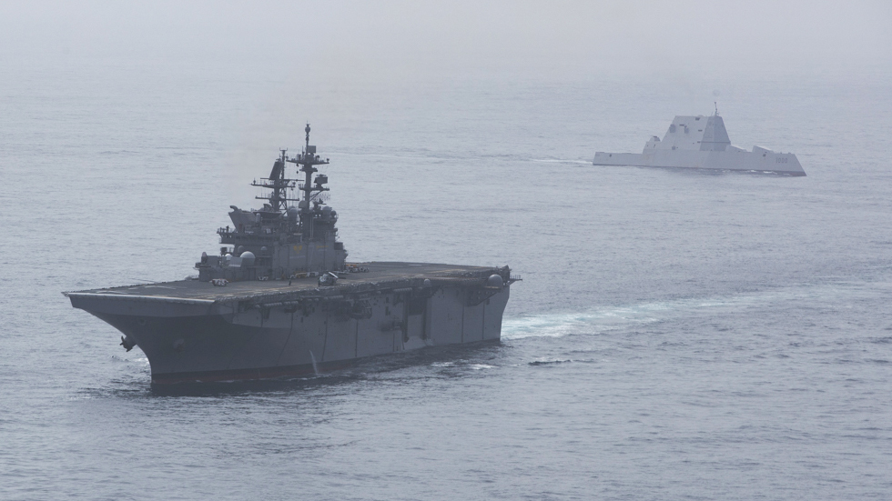 220410-N-VJ326-3285 PACIFIC OCEAN (April 10, 2022) – Amphibious assault ship USS Tripoli (LHA 7) sails ahead of guided-missile destroyer USS Zumwalt (DDG 1000) in the Pacific Ocean, April 10. Tripoli and Zumwalt are underway conducting routine operations in U.S. 3rd Fleet. (U.S. Navy photo by Mass Communication Specialist 2nd Class Malcolm Kelley)