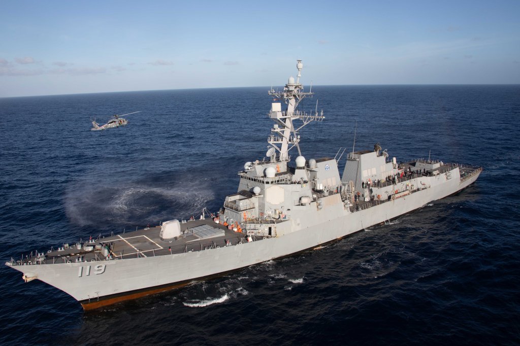 Santa Claus, flying in an MH-60S Sea Hawk, attached to the "Tridents" of Helicopter Sea Combat Squadron (HSC) 9, greets Sailors assigned to the Arleigh Burke guided-missile destroyer USS Delbert D. Black (DDG 119) in the Mediterranean Sea, Dec. 24, 2023. The Gerald R. Ford Carrier Strike Group is currently operating in the Mediterranean Sea. The U.S. maintains forward-deployed, ready, and postured forces to deter aggression and support security and stability around the world. (U.S. Navy photo by Mass Communication Specialist 2nd Class Jacob Mattingly)