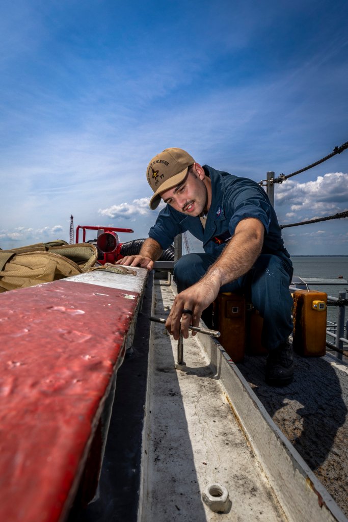 250722-N-EU577-2053 NAVAL STATION NORFOLK (July 22, 2025) Aviation Boatswain’s Mate (Handling) 3rd Class Luke Martin rethreads a scupper insert aboard the Nimitz-class aircraft carrier USS George H.W. Bush (CVN 77). George H.W. Bush is pierside at Naval Station Norfolk in support of Material Assist Visit (MAV) III, in preparation for Board of Inspection and Survey (INSURV). INSURV is a Congressionally-mandated assessment of a ship's readiness condition to ensure all spaces and equipment meet Navy standards. (U.S. Navy photo by Mass Communication Specialist Seaman Apprentice Kayleigh Tucker)