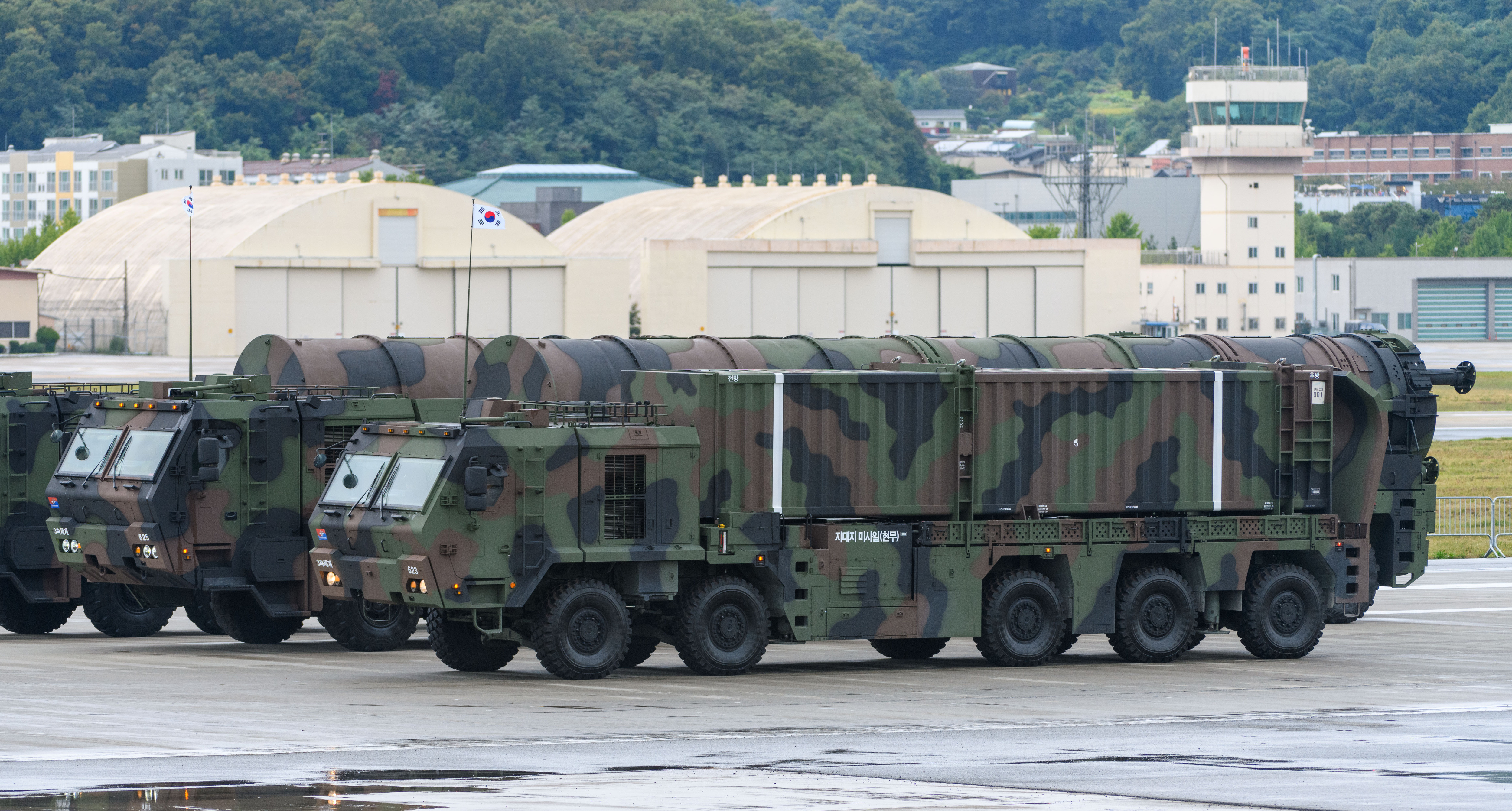 SEONGNAM, SOUTH KOREA - 2024/10/01: South Korea's Transporter erector launchers carrying Hyunmoo-4 (front) and Hyunmoo-5 (back) surface-to-surface missiles during a ceremony marking the 76th Armed Forces Day held at Seoul Air Base. South Korean President Yoon Suk Yeol said on October 1 that North Korea will face the end of its regime if it attempts to use nuclear weapons, warning a "resolute and overwhelming" response from the South Korea-U.S. alliance. President Yoon made the remark during a speech marking the 76th Armed Forces Day, as North Korea has intensified its nuclear threats with the first public disclosure of its uranium enrichment facility last month. (Photo by Kim Jae-Hwan/SOPA Images/LightRocket via Getty Images)