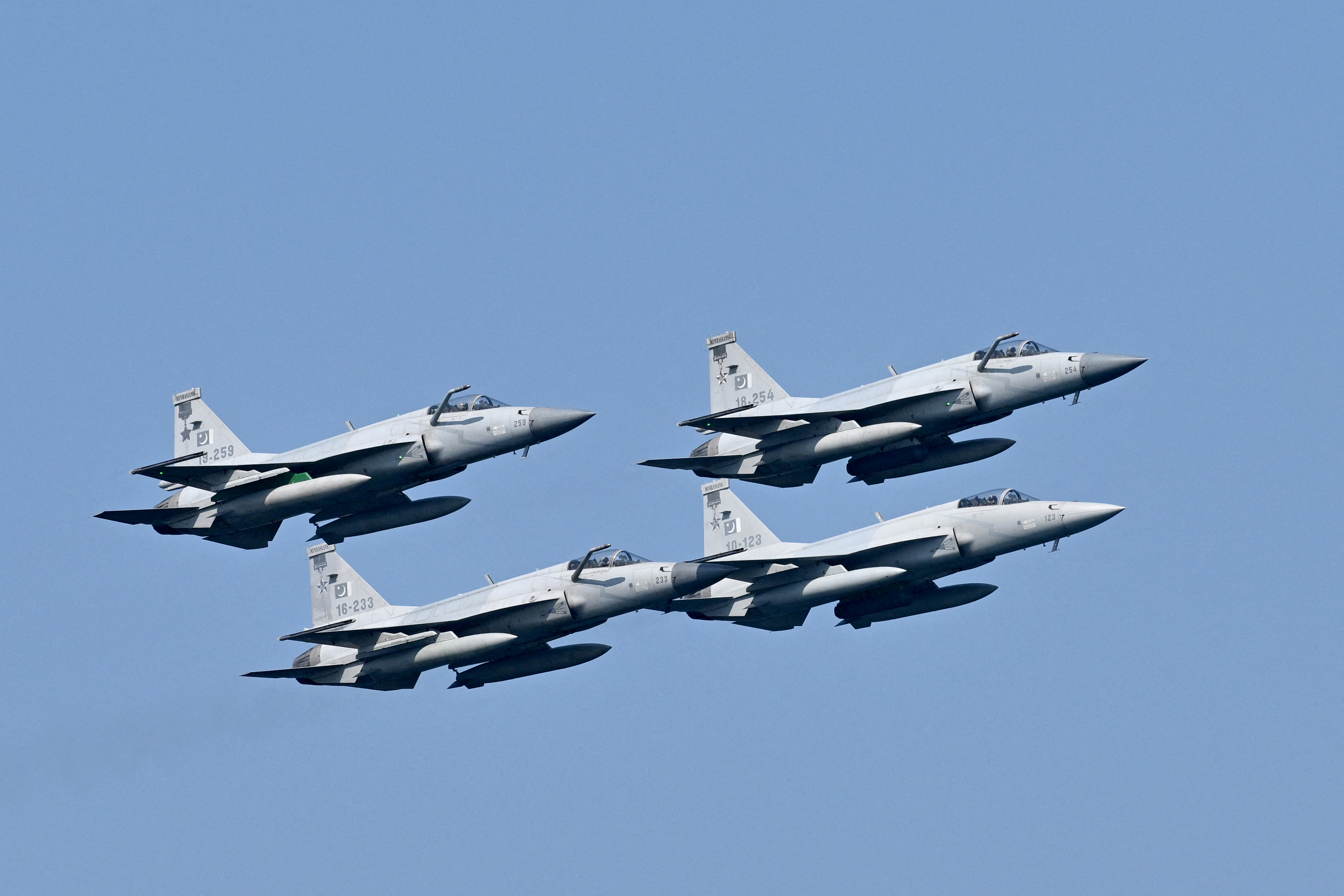 Pakistan's Air Force fighter JF-17 fighter jets fly past during the multinational naval exercise AMAN-25 in the Arabian Sea near Pakistan's port city of Karachi on February 10, 2025, as more than 50 countries participating with ships and observers. (Photo by Asif HASSAN / AFP) (Photo by ASIF HASSAN/AFP via Getty Images)