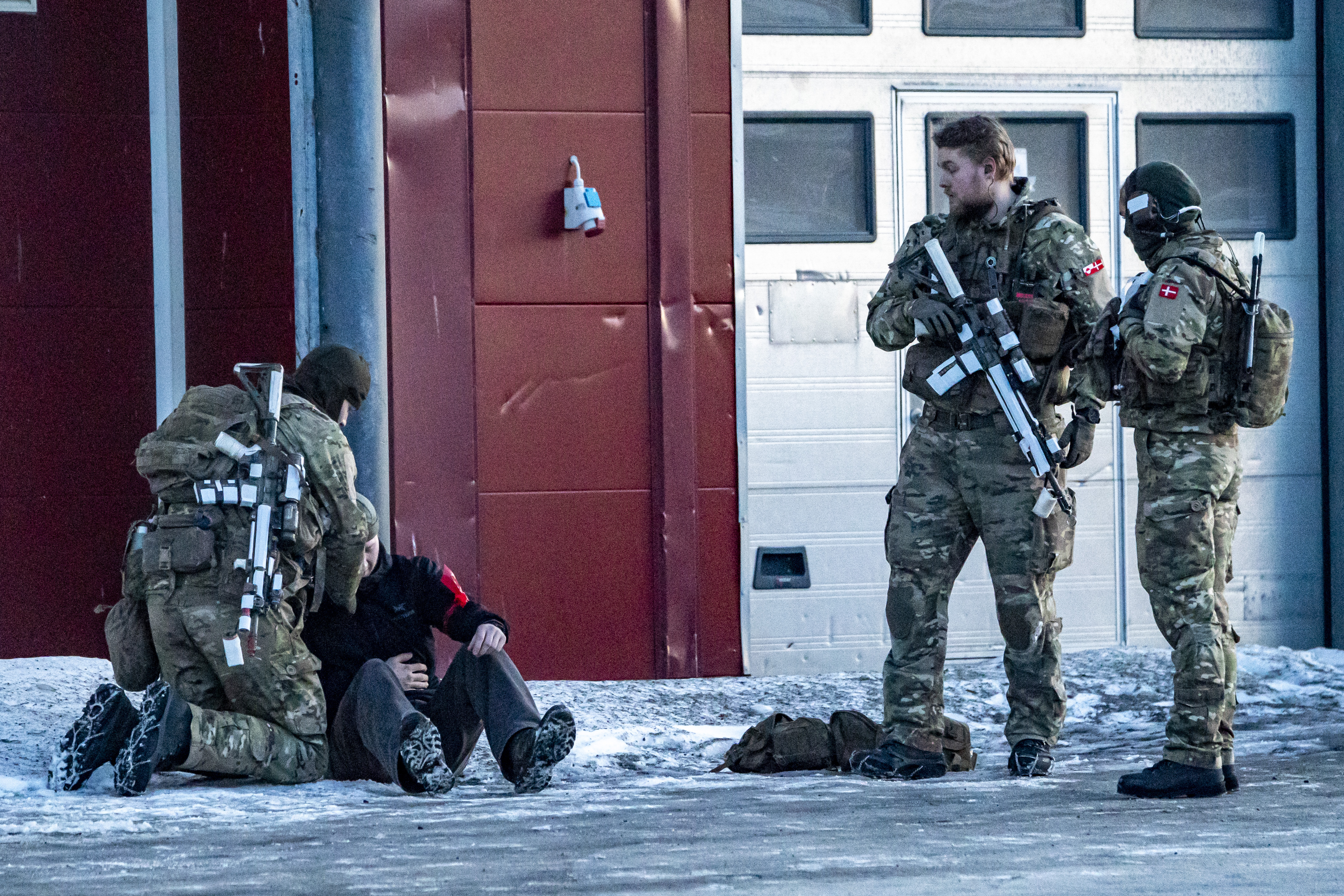 Danish soldiers conduct a military exercise at the docks Nuuk, Greenland. US president Donald Trump has backed down on his threat to impose tariffs on the UK and other Nato allies who opposed his ambitions to annex Greenland. Picture date: Monday January 26, 2026. (Photo by Ben Birchall/PA Images via Getty Images)