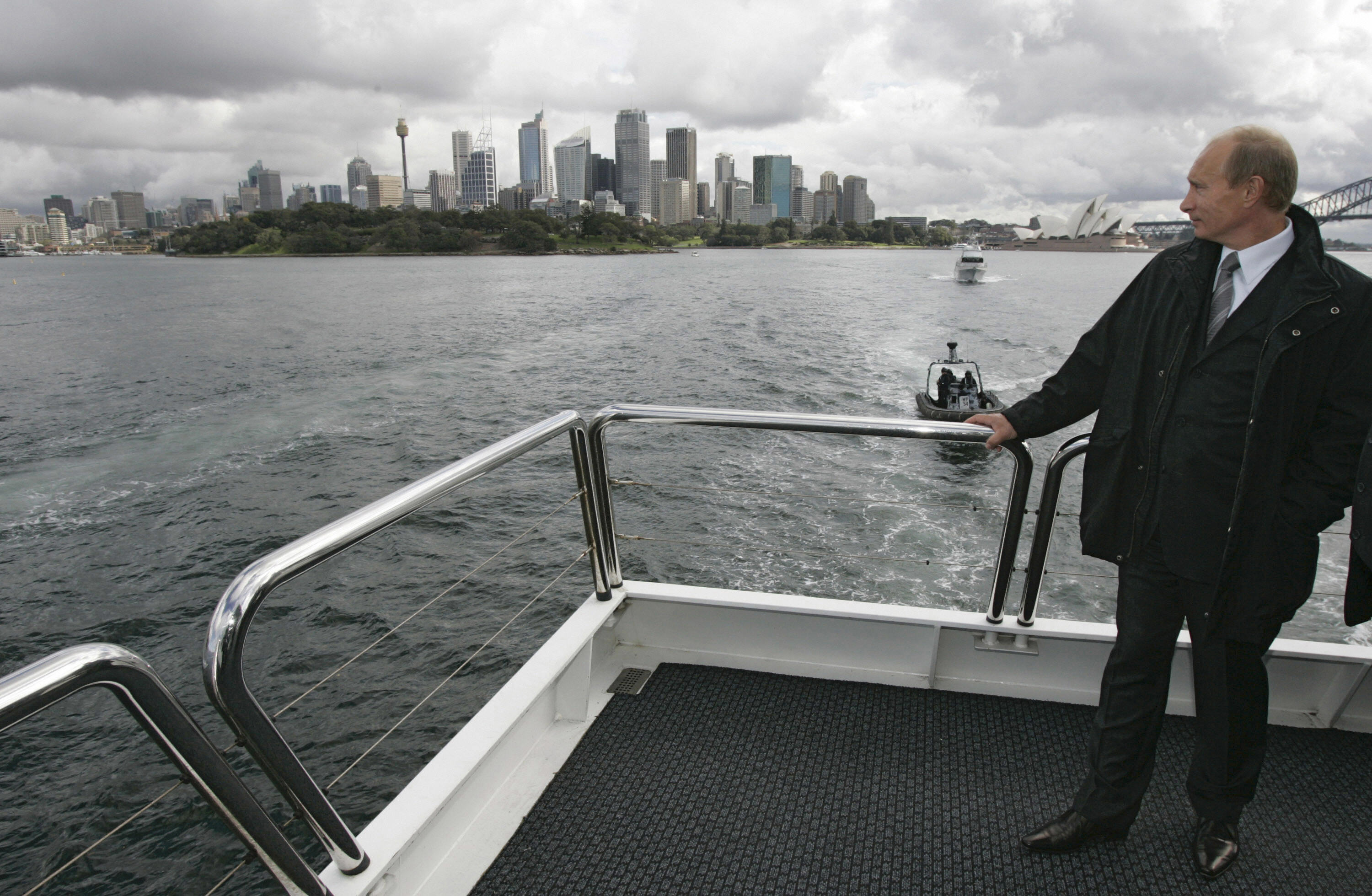 Russian President Vladimir Putin stands on a board a yacht during a sail along Sydney Harbour, 07 September 2007, prior to the Asia-Pacific Economic Cooperation (APEC) summit opening. APEC's 21 leaders will hold their annual meeting from 08 to 10 September. AFP PHOTO / RIA NOVOSTI / KREMLIN POOL / DMITRY ASTAKHOV (Photo credit should read DMITRY ASTAKHOV/AFP via Getty Images)
