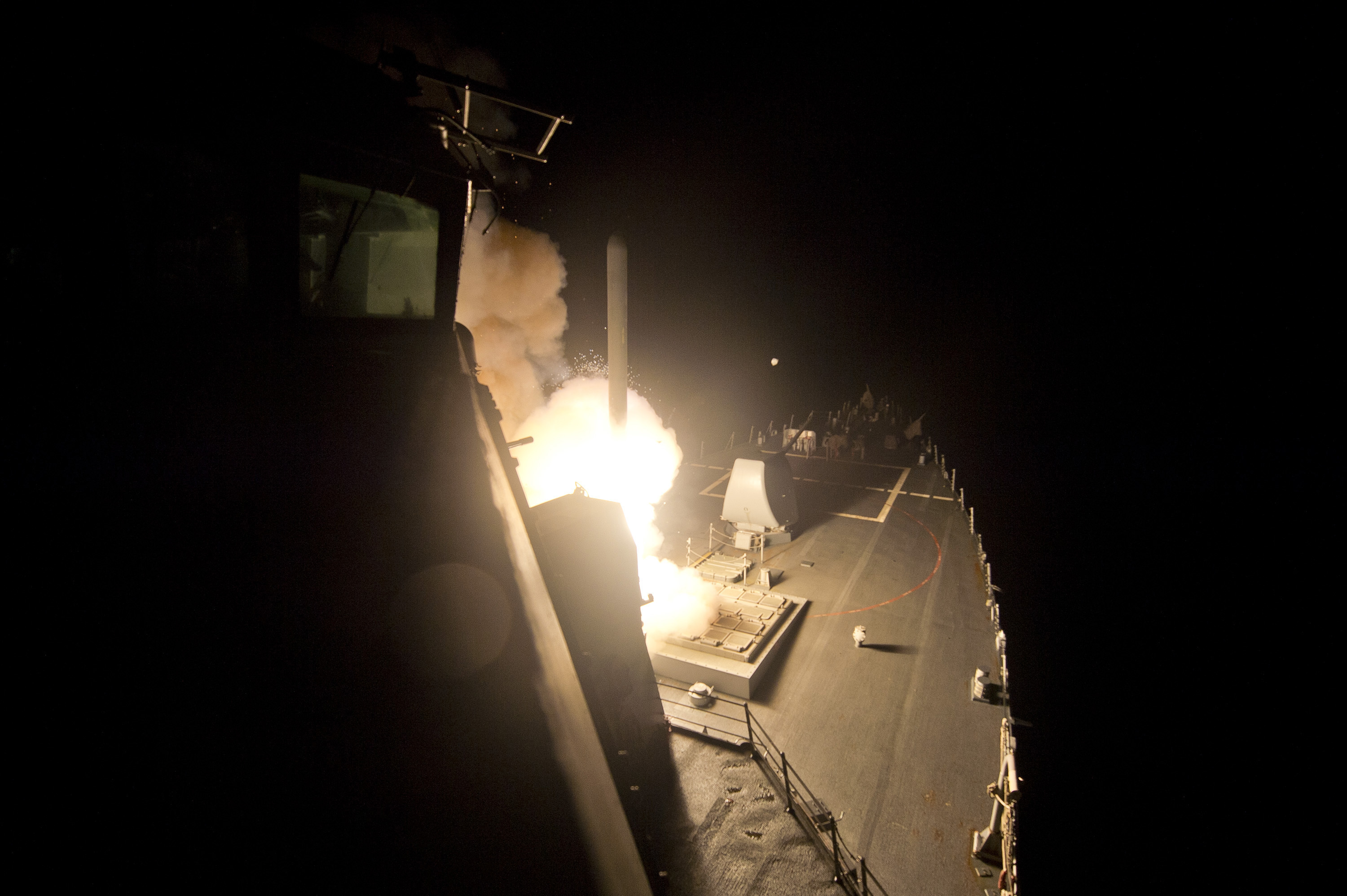 The guided-missile destroyer USS Arleigh Burke (DDG 51) launches Tomahawk cruise missiles to conduct strikes against ISIL targets. Arleigh Burke is deployed in the U.S. 5th Fleet area of responsibility supporting maritime security operations and theater security cooperation efforts. (U.S. Navy photo by Mass Communication Specialist 2nd Class Carlos M. Vazquez II/Released)
