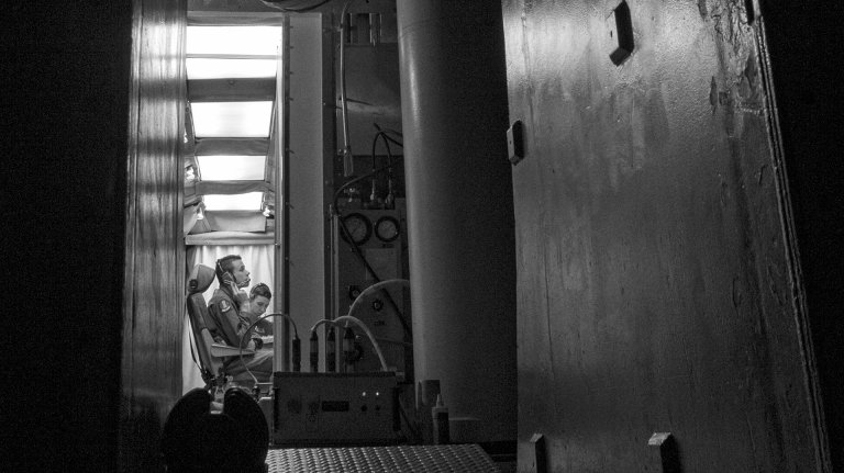 Missileers with the 321st Missile Squadron run through the test sequence document during the Simulated Electronic Launch-Minuteman test inside the launch control center at a missile alert facility in the 90th Missile Wing's missile complex, Neb., April 11, 2017. The missileers worked heavily in conjunction with missile maintainers to conduct a test of Minuteman III weapon system components. A successful test proves the ICBM weapon system's effectiveness in a safe and secure manner. (U.S. Air Force photo by Staff Sgt. Christopher Ruano)