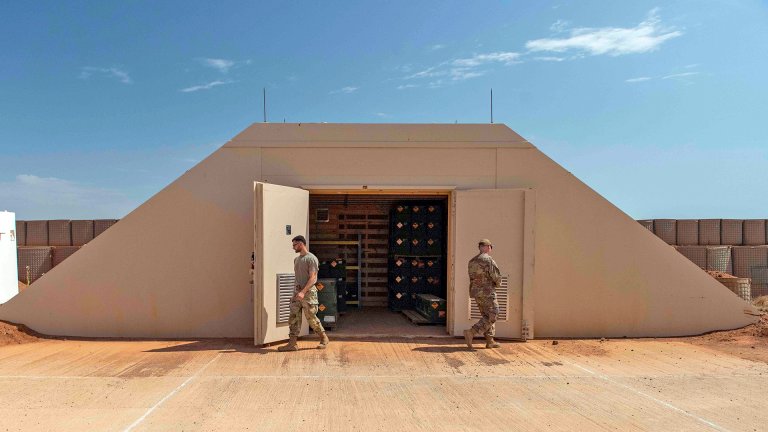 U.S. Air Force Airman 1st Class Lucas Keka, left, munitions operations technician assigned to the 726th Expeditionary Mission Support Squadron, and Staff Sgt. Daryc Fliginger, 726th EMSS Munitions Flight production supervisor, secure a munitions storage bunker at Chabelley Airfield, Djibouti, Aug. 25, 2023. The 726th EMSS provides security forces, satellite communications, munitions support, vehicle management, contracting, finance and logistics in support of USAF personnel in East Africa. (U.S. Air Force photo by Tech. Sgt. Dhruv Gopinath)