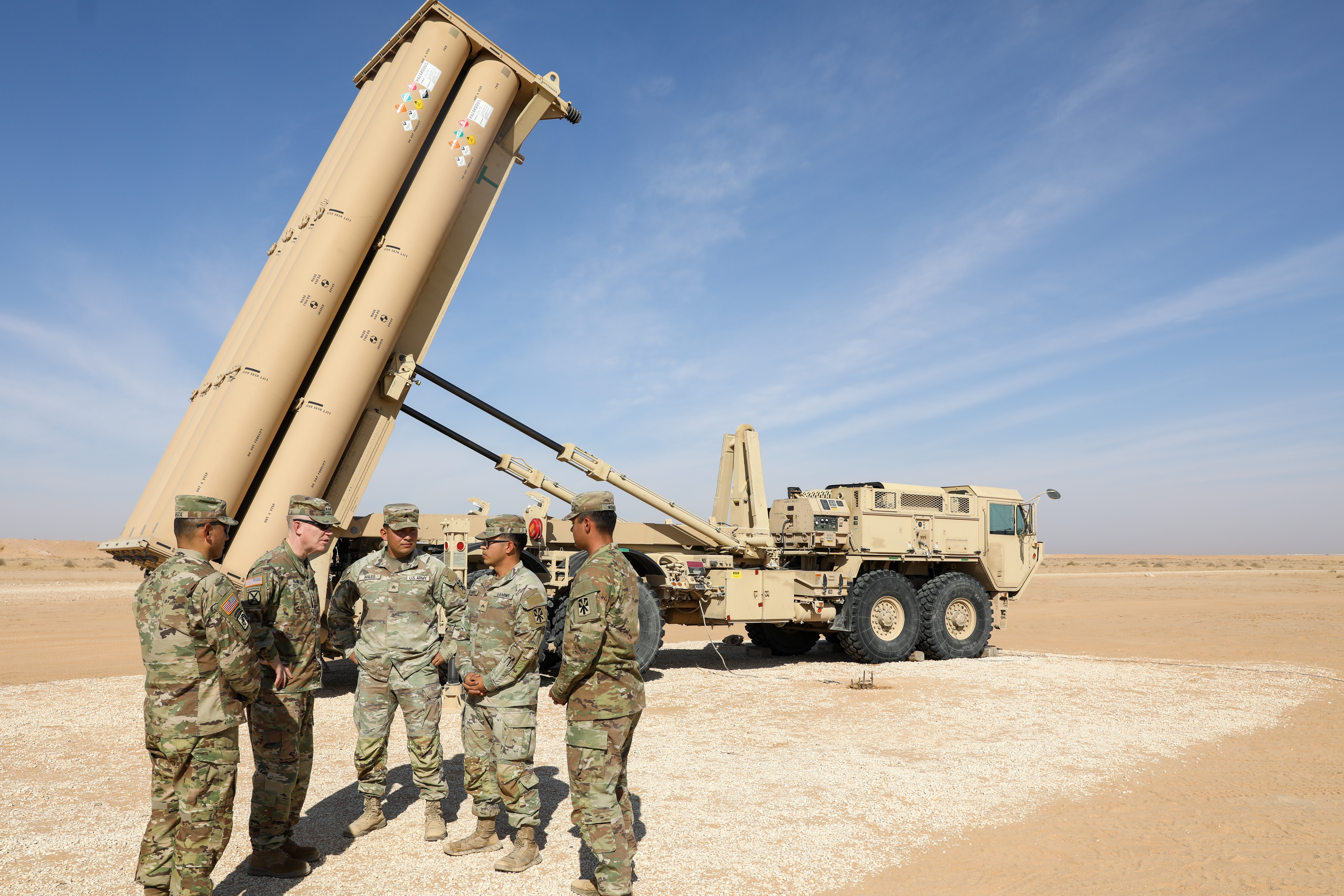 Lt. Gen. Patrick Frank, U.S. Army Central Commanding General, meets with a Terminal High Altitude Area Defense (THAAD) crew next to a launcher emplaced and prepared to launch interceptors to counter ballistic missile threats at an undisclosed location in the CENTCOM Area of Operations, Dec. 12, 2023. THAAD is an important component of the integrated air and missile defense network that defends critical assets in the U.S Central Command area of responsibility amidst needs for increased force protection. (U.S. Army Courtesy Photo)