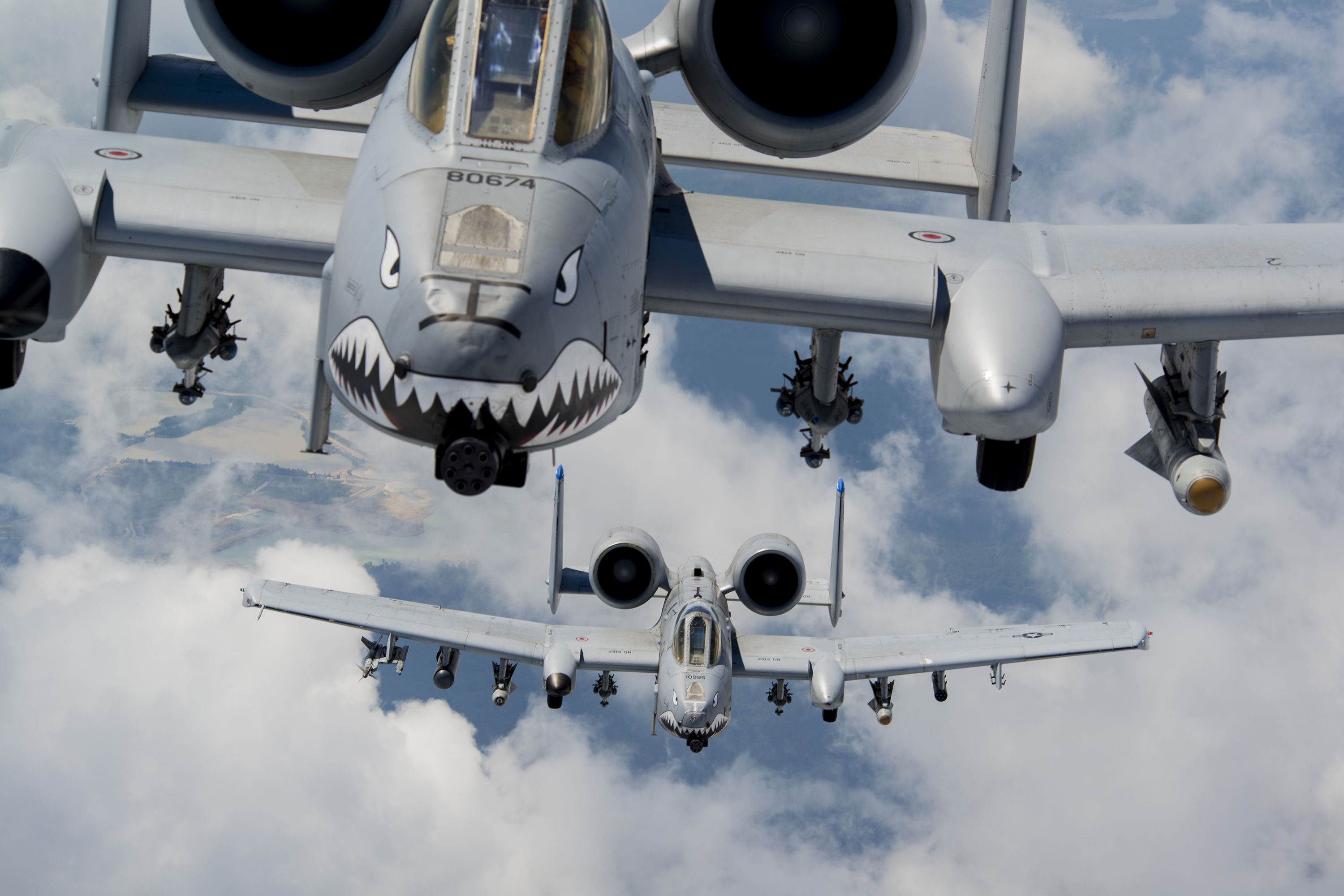 U.S. Air Force Capts. Andrew Glowa, lead, and William Piepenbring, both with the 74th Fighter Squadron out of Moody Air Force Base, Ga., fly two A-10C Thunderbolt II over the skies of southern Georgia, Aug. 18, 2014. The 74th FS is one of two active-duty, combat-ready squadrons at Moody that performs close air support missions with the A-10. (U.S. Air Force photo by Staff Sgt. Jamal D. Sutter/Released)
