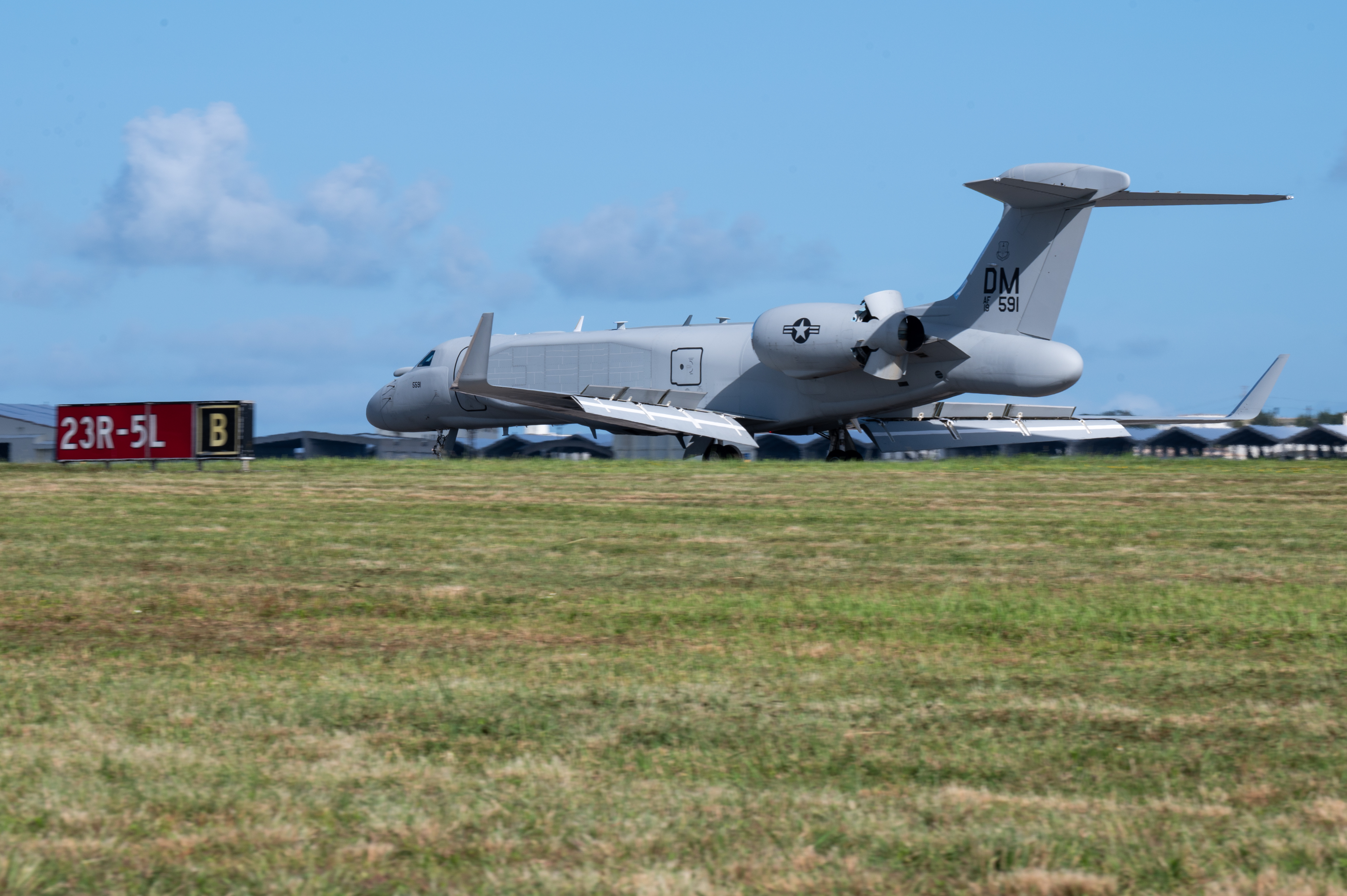 A U.S. Air Force EA-37B Compass Call assigned to the 55th Electronic Combat Group lands at Kadena Air Base, Japan, Sept. 27, 2025. The aircraft integrated with Navy EA-18 Growlers from Electronic Attack Squadron 131, demonstrating U.S. commitment to a free and open Indo-Pacific while strengthening joint capabilities, maintaining dominance across the electromagnetic spectrum, and deterring potential threats in the region. (U.S. Air Force photo by Senior Airman Melany Bermudez)