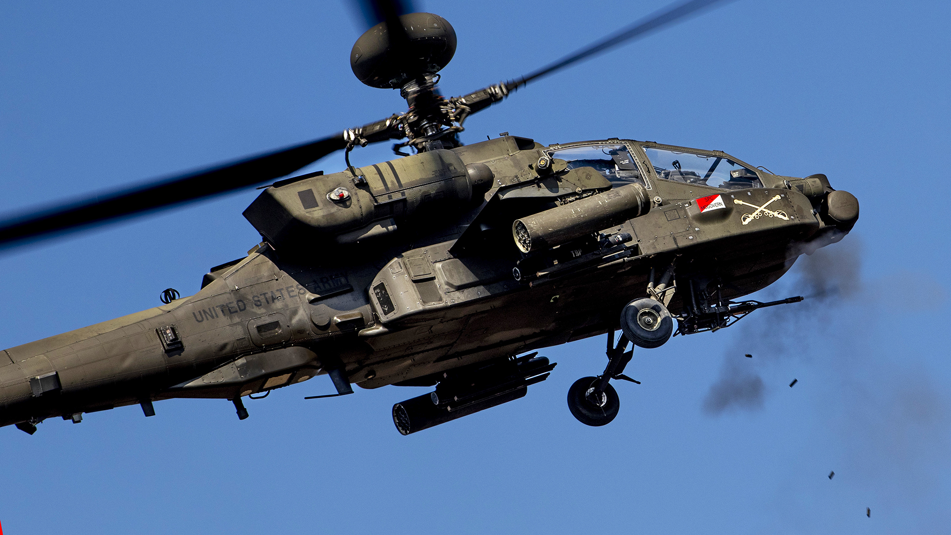 A U.S. Army AH-64 Apache helicopter assigned to the 5-17 Air Cavalry Squadron, 2nd Infantry Division, fires the M230 Bushmaster chain gun during live-fire aerial gunnery training at Rodriguez Live Fire Complex, Republic of Korea, on March 6, 2025. The exercise certified aircrews, sharpened weapons proficiency, and enhanced overall force readiness. (U.S. Army photo by Staff Sgt. Neil McLean)