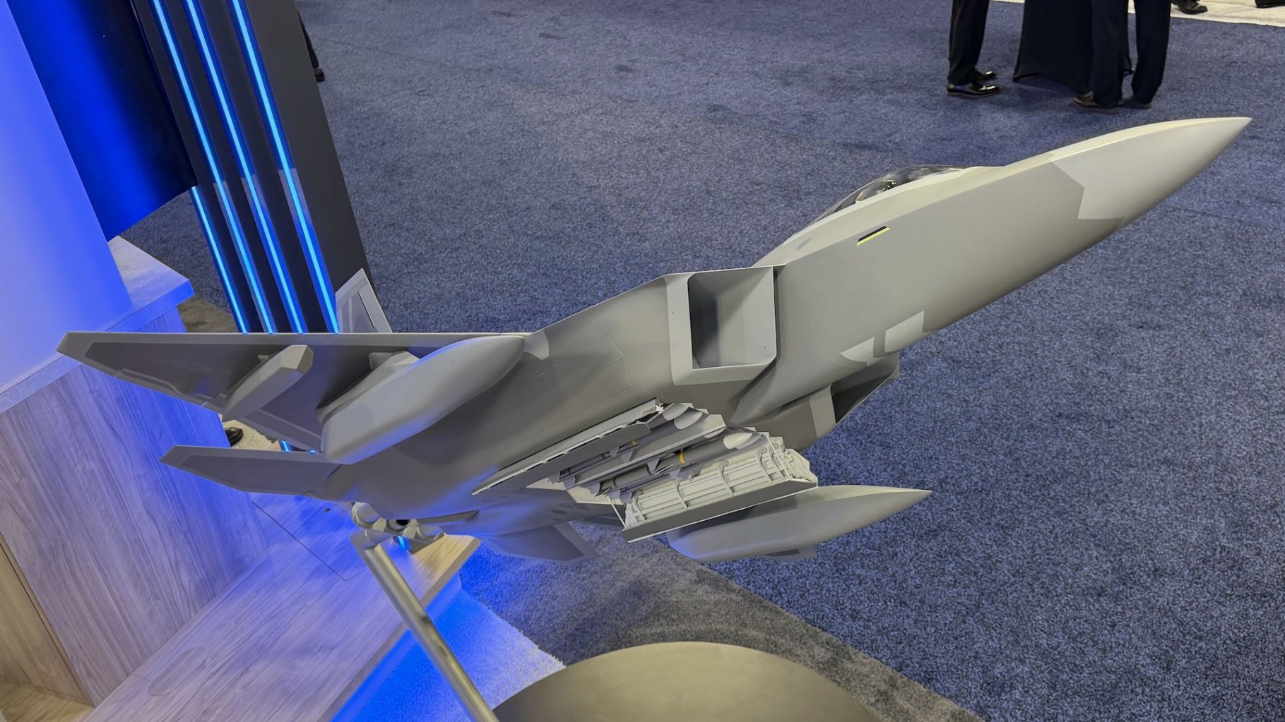 Lockheed Martin has presented a scale model of the new-look F-22 Raptor fitted with stealthy external fuel tanks and underwing infrared sensor pods. Up to this point, the fuel tanks had been seen in renderings as well as at least one long-distance photo that revealed little in the way of details. The sensor pods had previously been seen at closer quarters during flight testing, as you can read about here.