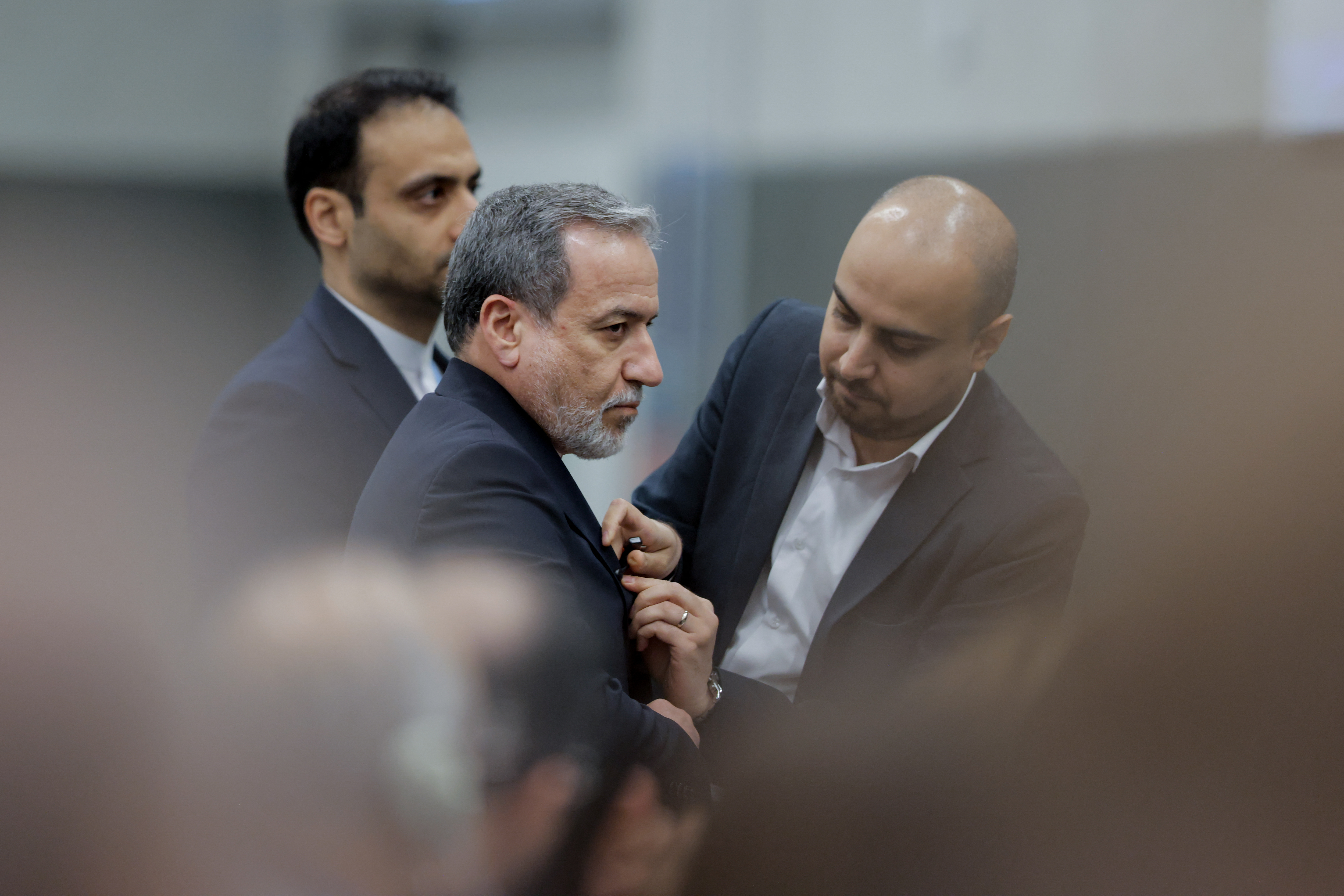 Iran's Foreign Minister Abbas Araghchi (C) looks on prior to delivering a speech during a session of the United Nations Conference on Disarmament, on the sideline of a second round of US-Iranian talks with Washington pushing Tehran to make a deal to limit its nuclear programme, in Geneva, on February 17, 2026. (Photo by Valentin Flauraud / AFP via Getty Images)
