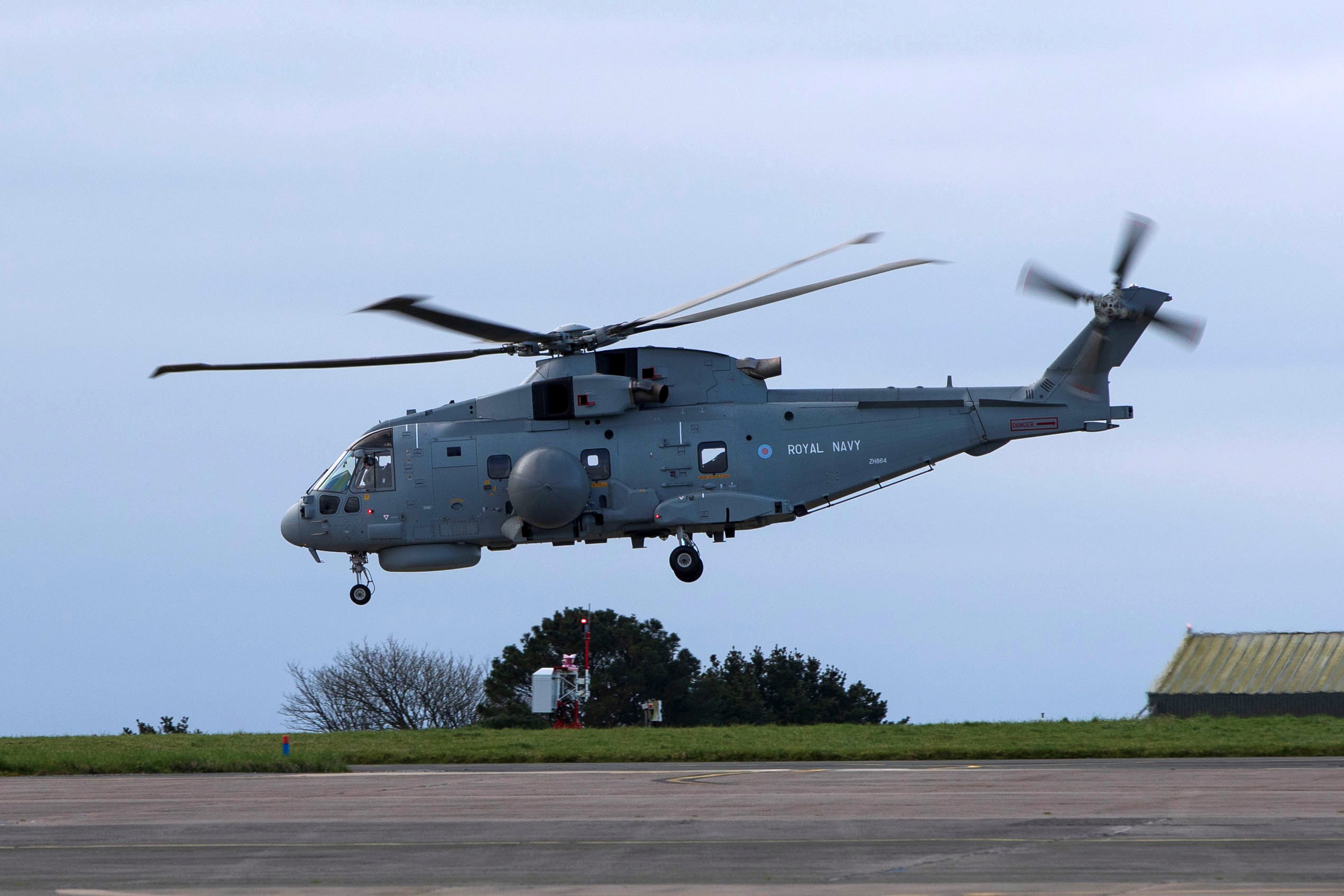 Image of a Royal Navy Merlin helicopter from RNAS Culdrose, seen here departing for the Middle East today (07/03/2026). Merlin HM2 helicopters are equipped with anti-submarine warfare (ASW) and airborne surveillance and control (ASaC). Additional typhoon jets have arrived in the Middle East, further strengthening the UK's defensive capabilities in the region. The UK is conducting air operations in defence of British interests and allies.