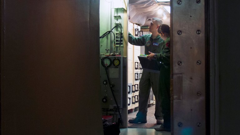 First Lt. Pamela Blanco-Coca, 319th Missile Squadron missile combat crew commander, and 2nd Lt. John Anderson, 319th MS deputy missile combat crew commander, conduct pre-operational checks at a launch control center in the F.E. Warren Air Force Base, Wyo., missile complex Feb. 9, 2016. The missileers worked heavily in conjunction with missile maintainers to conduct a test of Minuteman III weapon system components in a test known as the Simulated Electronic Launch-Minuteman. (U.S. Air Force photo by Senior Airman Jason Wiese)