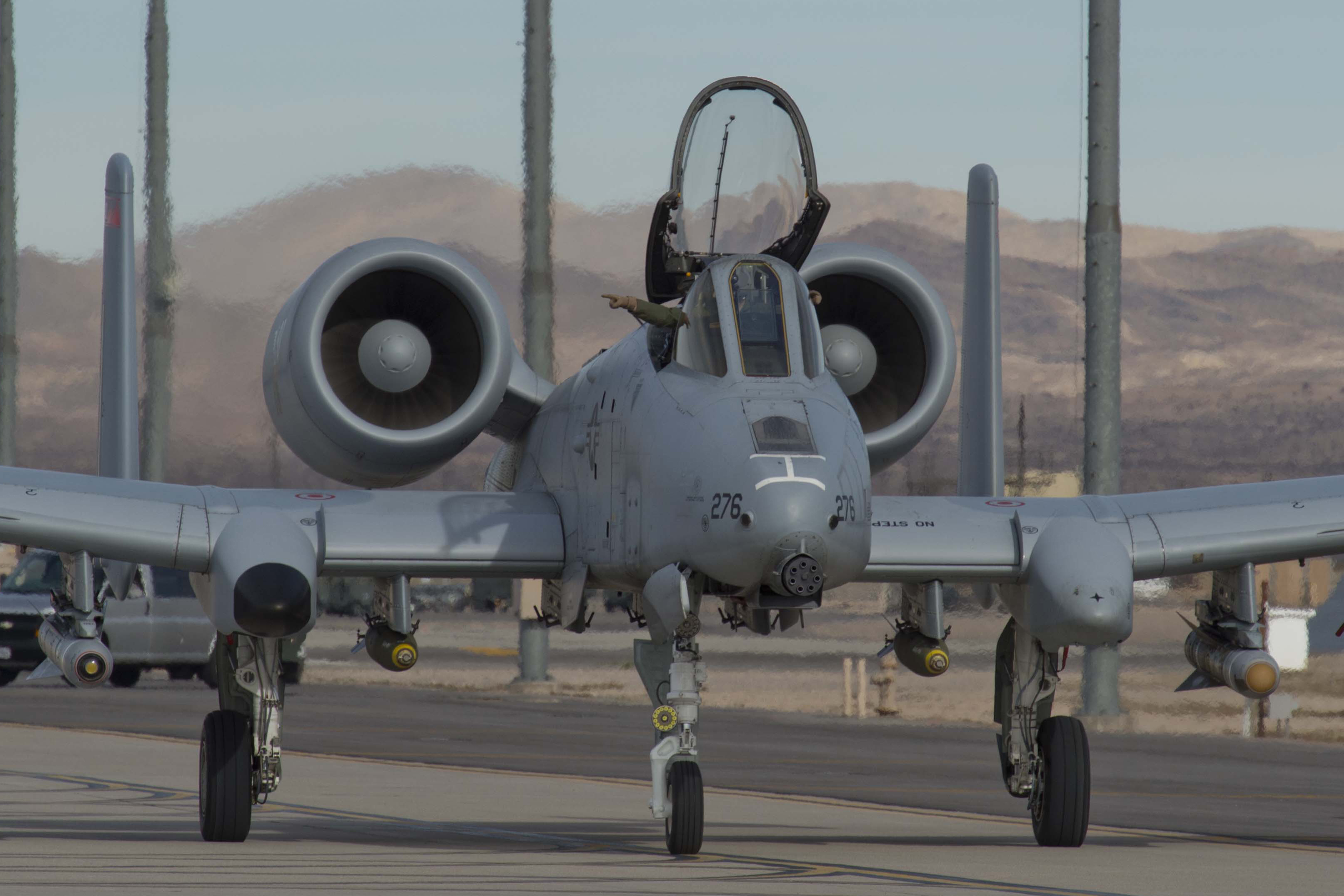 A four-ship of A-10C Thunderbolt IIs from the 190th Fighter Squadron at Gowen Field, Idaho prepare for take off at Nellis Air Force Base, Nev. Jan 17, 2016 while taking part in Green Flag 16-03. Green Flag is an advanced joint air to surface training exercise designed to better train pilots in their role to support ground forces at the U.S. Army National Training Center at Fort Irwin, California. (U.S. Air National Guard Photo by Tech. Sgt. Sarah Pokorney/released)