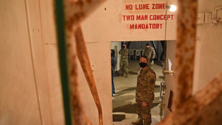 U.S. Air Force Lt Col. John Bergmans, 315th Training Squadron commander, enters the Lawn Atlas Missile Base’s missile silo while exploring the narratives of actual personnel deployed to the site during the Cuban Missile Crisis in Lawn, Texas, Dec. 3, 2020. Bergmans attended the Staff Ride to LAMB in support of the 17th Training Wing Heritage Campaign Plan that was founded on Air Force heritage and the Airmen Warrior Ethos among attending personnel.. (U.S. Air Force photo by Senior Airman Abbey Rieves)