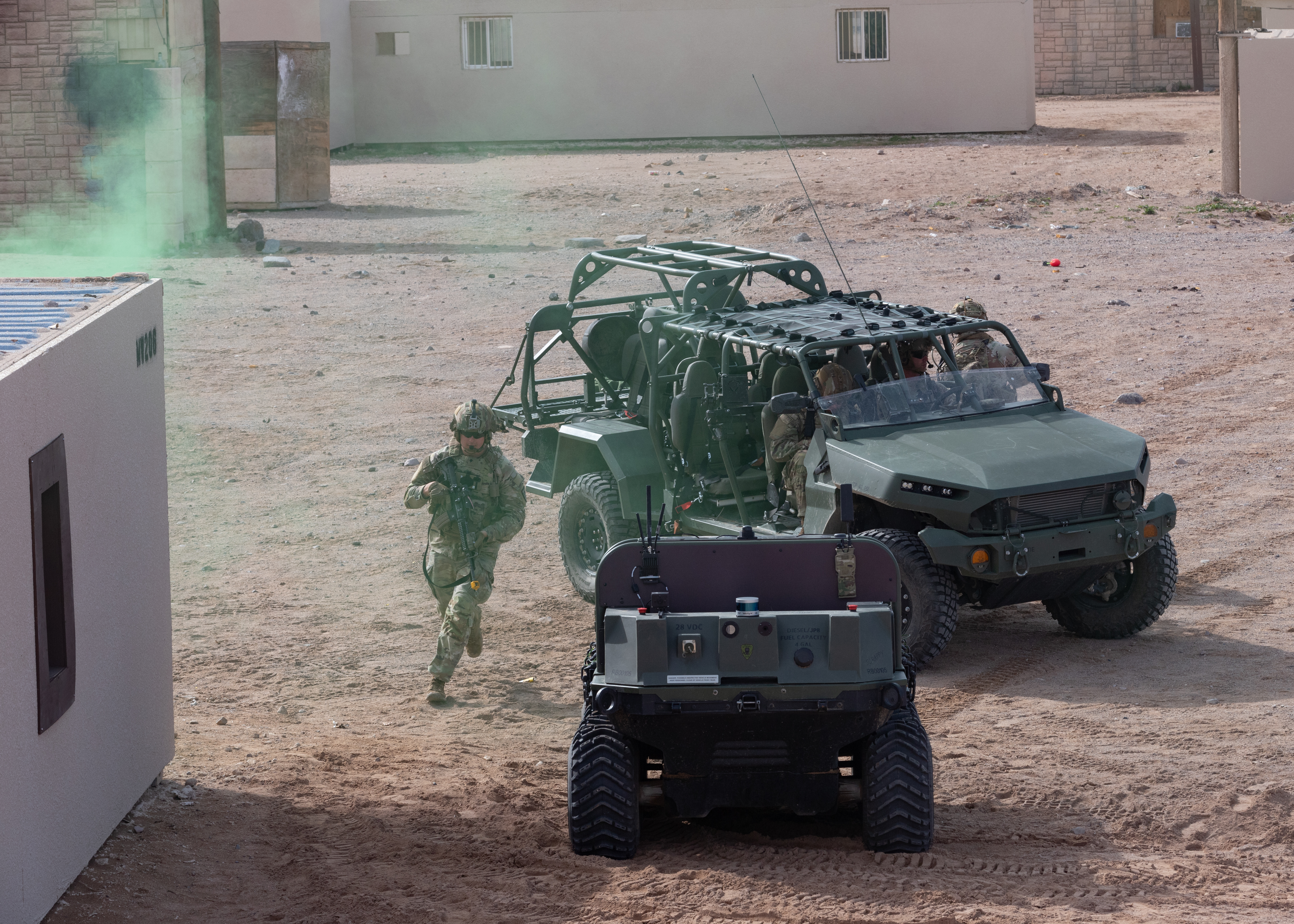 U.S. Army Soldiers assigned to the 1st Battalion, 29th Infantry Regiment, 316th Cavalry Brigade, based at Fort Moore, Ga., use the Hunter WOLF, an unmanned ground vehicle, to retrieve simulated casualties during a military capability demonstration as part of Project Convergence - Capstone 4 at Fort Irwin, Calif., March 17, 2024. The Hunter WOLF is a 6x6 robotic vehicle with a hybrid diesel/electric drivetrain, which can hold two litters on deck and can be rigged to side-carry an additional two litters for prolonged field care. (U.S. Army photo by Spc. Hunter Grice)