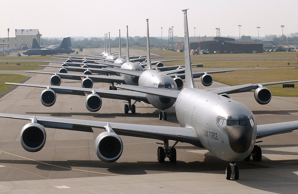 Seven U.S. Air Force KC-135 Stratotanker aircraft line up on the flight line for a training mission at Royal Air Force Station Mildenhall, United Kingdom, on March 13, 2006. (DoD photo by Staff Sgt. Jeanette Copeland, U.S. Air Force. (Released))