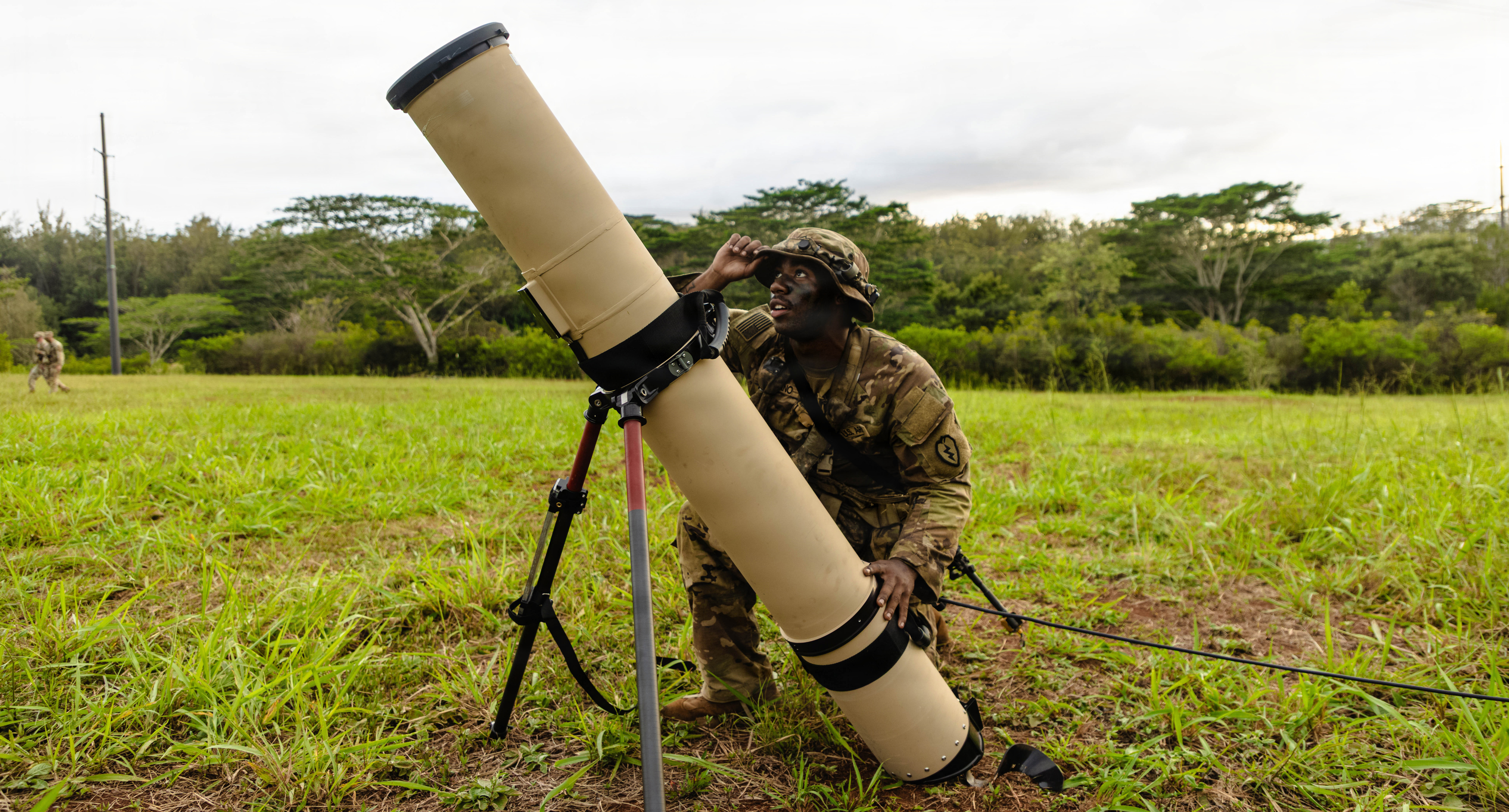 A U.S. Army Soldier with the 25th Infantry Division inspects a Switchblade launch tube during Joint Pacific Multinational Readiness Center (JPMRC) rotation 26-01, Nov. 6, 2025, at Schofield Barracks, Hawaii. JPMRC integrates U.S. forces, along with military members from France, Malaysia, Maldives, Philippines, Singapore, and Thailand, alongside New Zealand Staff Observers to refine joint capabilities and rehearse tactics, techniques, and procedures required to dominate jungle and archipelagic terrain during large-scale combat operations. The exercise underscores the U.S. Army’s commitment to ensuring regional security and strengthening partnerships in the Indo-Pacific area of responsibility. (U.S. Army photo by Sgt. Taylor Gray)