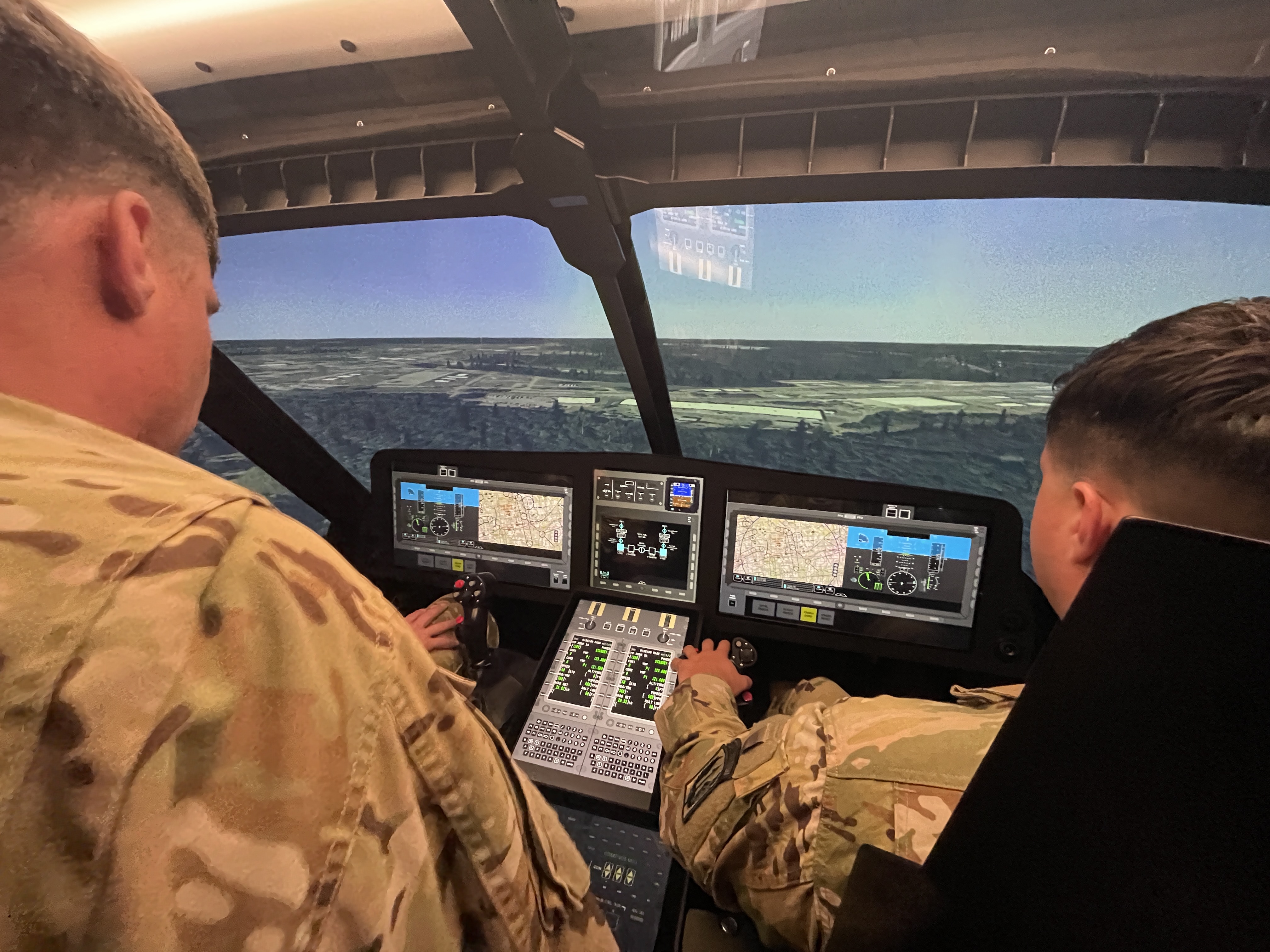 Soldiers gaining hands-on experience with the future of Army aviation, learning to operate the MV-75 through an immersive Virtual Prototype at Redstone Arsenal.