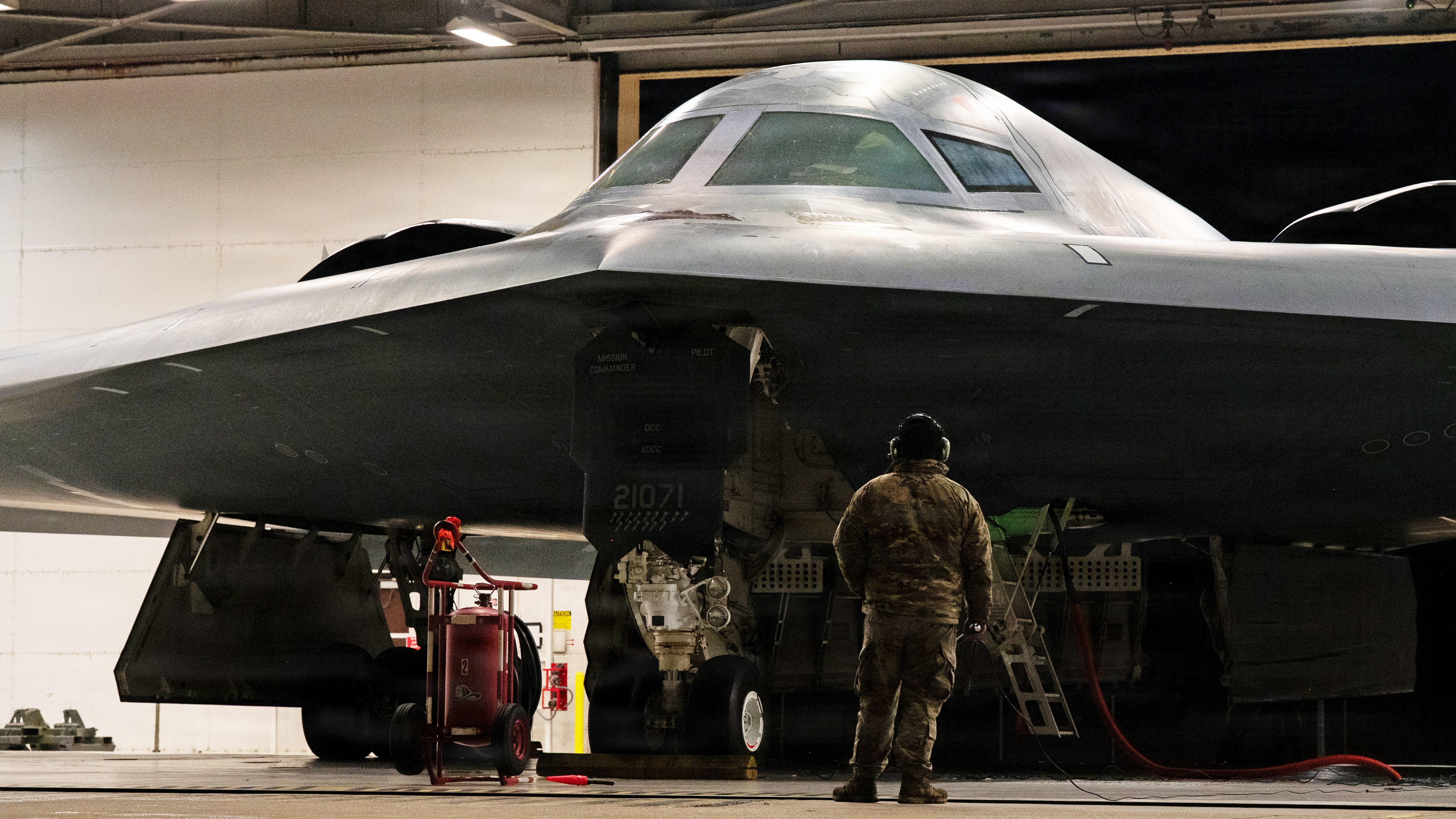 U.S. Air Force crew chiefs perform pre-flight checks on a B-2 Spirit stealth bomber during Operation Epic Fury, March 17, 2026. (U.S. Air Force photo)