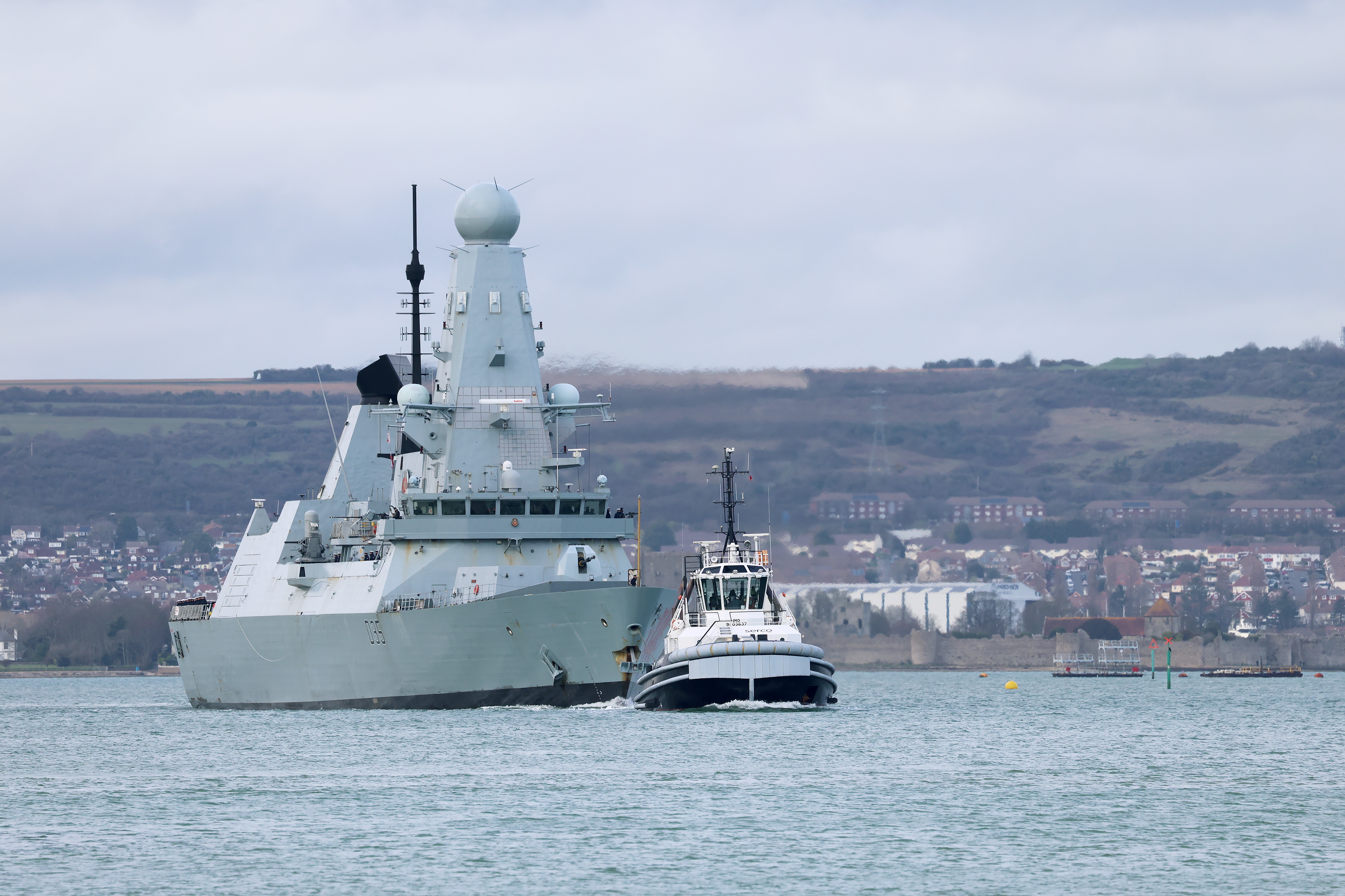 Royal Navy destroyer HMS Dragon today departed the UK to head to the Eastern Mediterranean to bolster British defences in the region today (10/03/2026). The crew’s loved ones joined hundreds of well-wishers lining the seawall as Dragon slipped out of Portsmouth Harbour, while last week drone-busting Wildcat helicopters departed from RNAS Yeovilton, and on Monday a Merlin Mk2 helicopter from RNAS Culdrose in Cornwall arrived in Cyprus. The Portsmouth-based warship will use her Sea Viper missile system to help safeguard UK assets and interests – assisted by Wildcats from 815 Naval Air Squadron equipped with Martlet missiles able to deal with the aerial drone threat. The decision to send the Royal Navy assets came as Iran’s attacks continue to target British interests in the region and the UK Armed Forces continue to adapt to the changing threats. It builds on the UK increased defensive presence in the region in recent weeks, including deploying radar systems, air defence, and F-35 stealth fighters which are already conducting air defence sorties. Based in Portsmouth and each with a crew of around 200 sailors, the Royal Navy’s six Type 45 destroyers are the Fleet’s first line of defence against aerial threats – aircraft, missiles, drones – and are capable of protecting an area up to five times the size of Cyprus. HMS Dragon can track hundreds of targets simultaneously – and eliminate them with the Sea Viper system which can launch eight missiles in under ten seconds and direct up to 16 missiles on to their targets simultaneously, closing in for the kill at up to four times the speed of sound, manoeuvring at G-Forces no human can endure. *** Local Caption ***