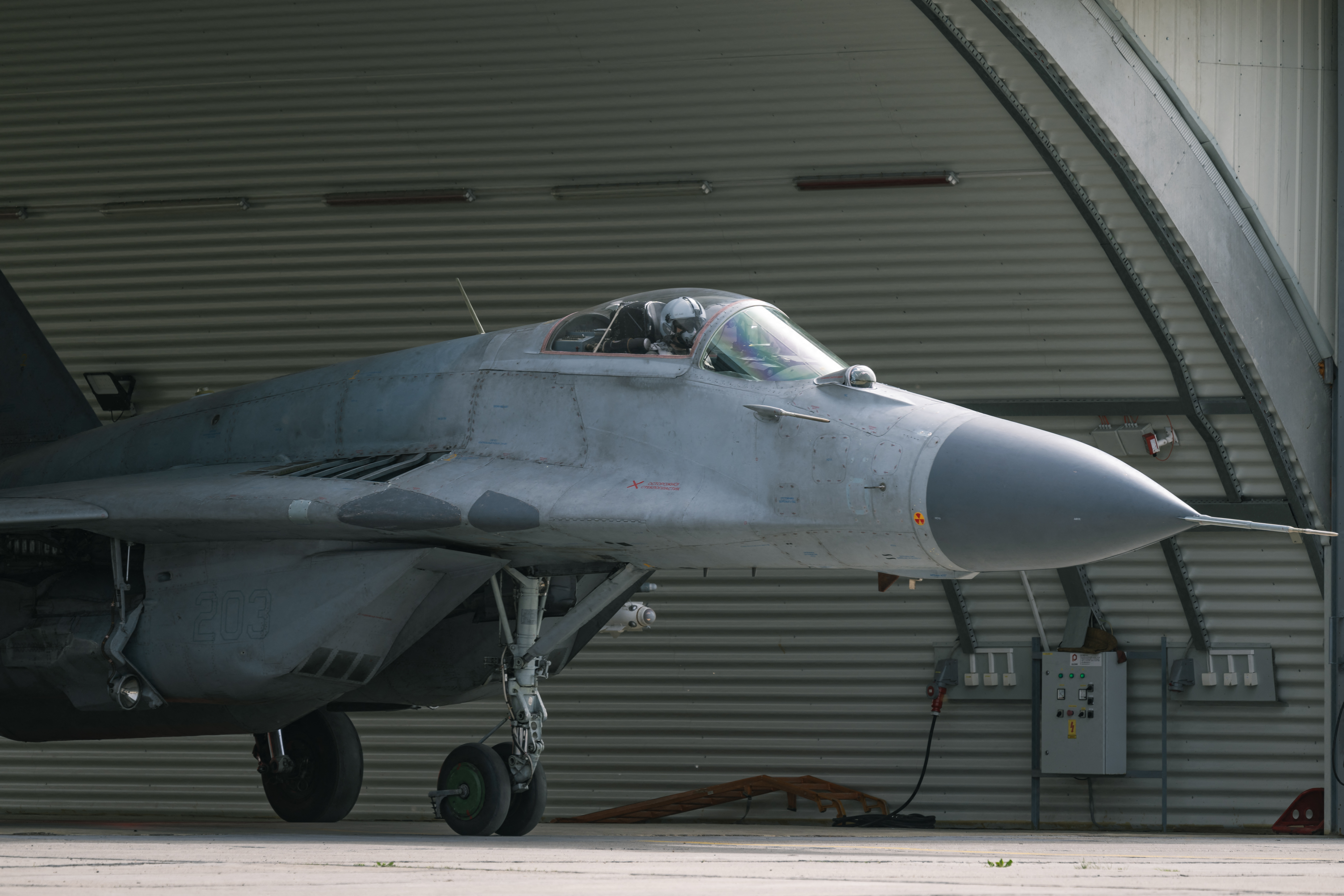 A pilot of the standby unit of the fighter aviation gets ready for take-off aboard a Mikoyan MiG-29 twin-engine fighter aircraft during a military excercise at the "Colonel-Pilot Milenko Pavlovic" military airport in Batajnica on March 31, 2024. The President of the Republic and the Supreme Commander of the Serbian Armed Forces, Aleksandar Vucic, visited on March 31, 2024 the standby unit of the fighter aviation for the control and protection of the airspace of the Republic of Serbia, at the "Colonel-Pilot Milenko Pavlovic" military airport in Batajnica. (Photo by Andrej ISAKOVIC / AFP) (Photo by ANDREJ ISAKOVIC/AFP via Getty Images)