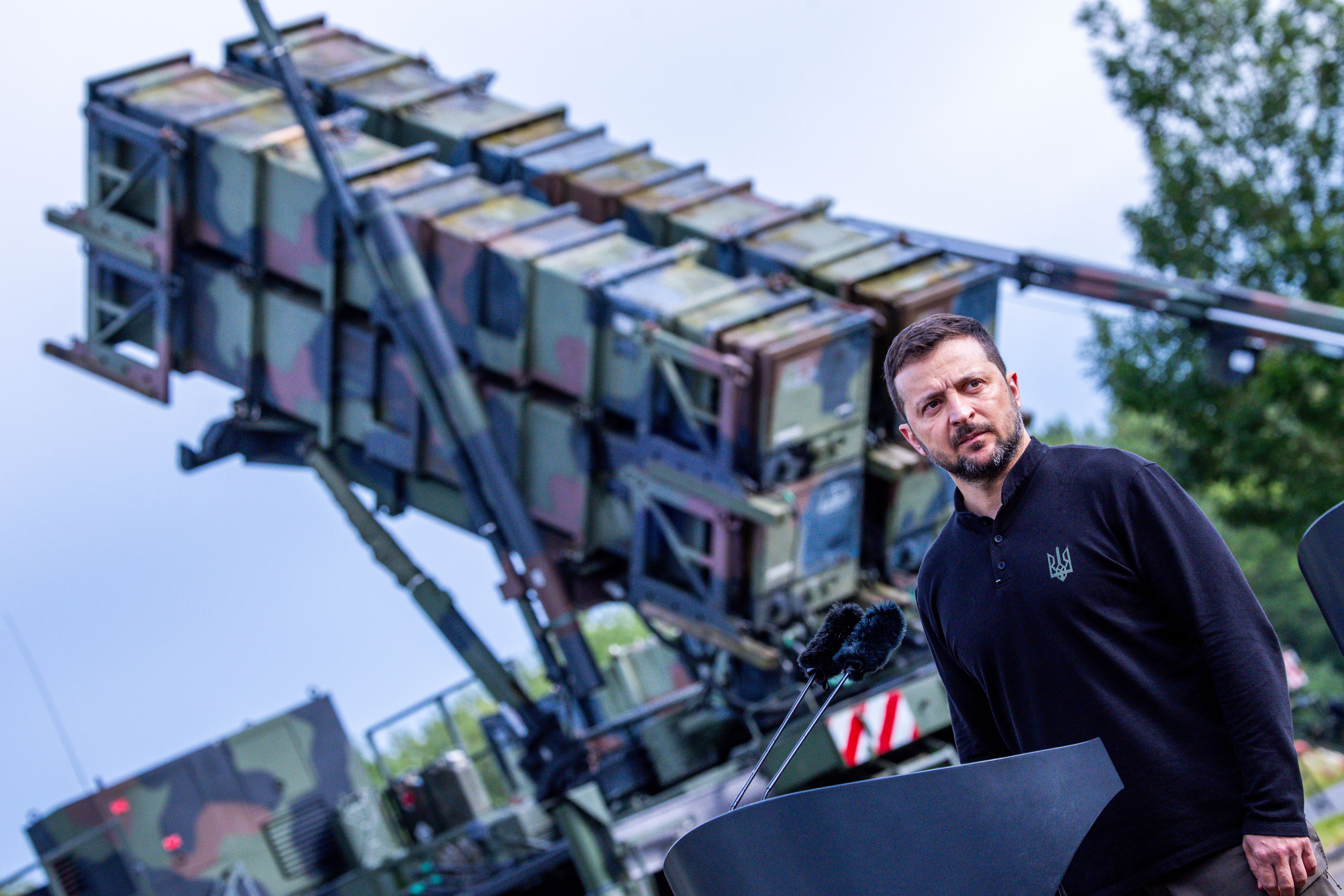 11 June 2024, Mecklenburg-Western Pomerania, ---: Volodymyr Zelenskyi, President of Ukraine, stands in front of the "Patriot" air defense missile system at a military training area during a visit to train Ukrainian soldiers. The international reconstruction conference for Ukraine takes place on June 11 and 12. Photo: Jens Büttner/dpa (Photo by Jens Büttner/picture alliance via Getty Images)