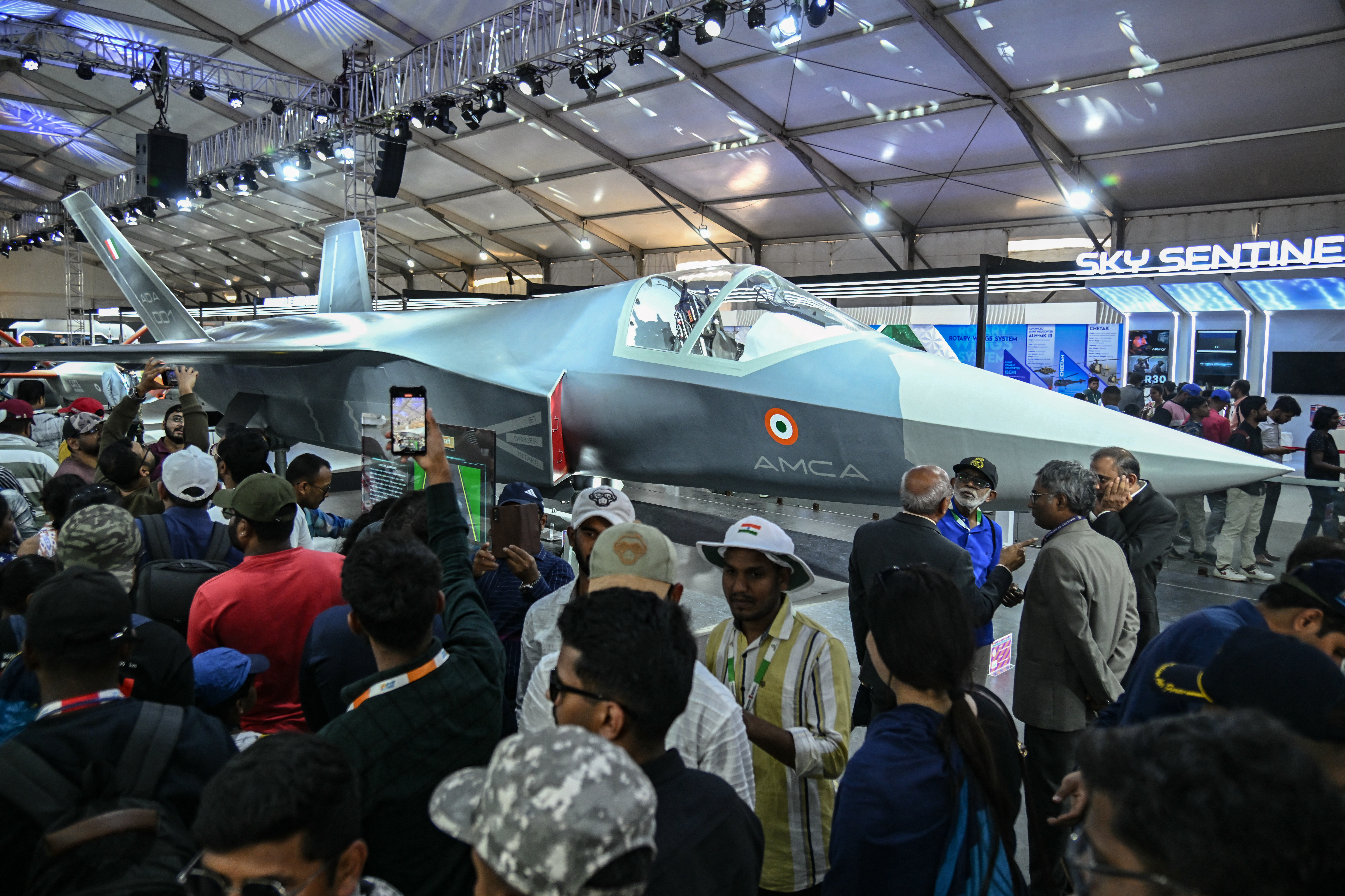 A full-scale model of India's Advanced Medium Combat Aircraft (AMCA) aircraft is displayed during the 15th edition of Aero India 2025 at Yelahanka Air Force Station in Bengaluru on February 14, 2025. (Photo by Idrees MOHAMMED / AFP) (Photo by IDREES MOHAMMED/AFP via Getty Images)