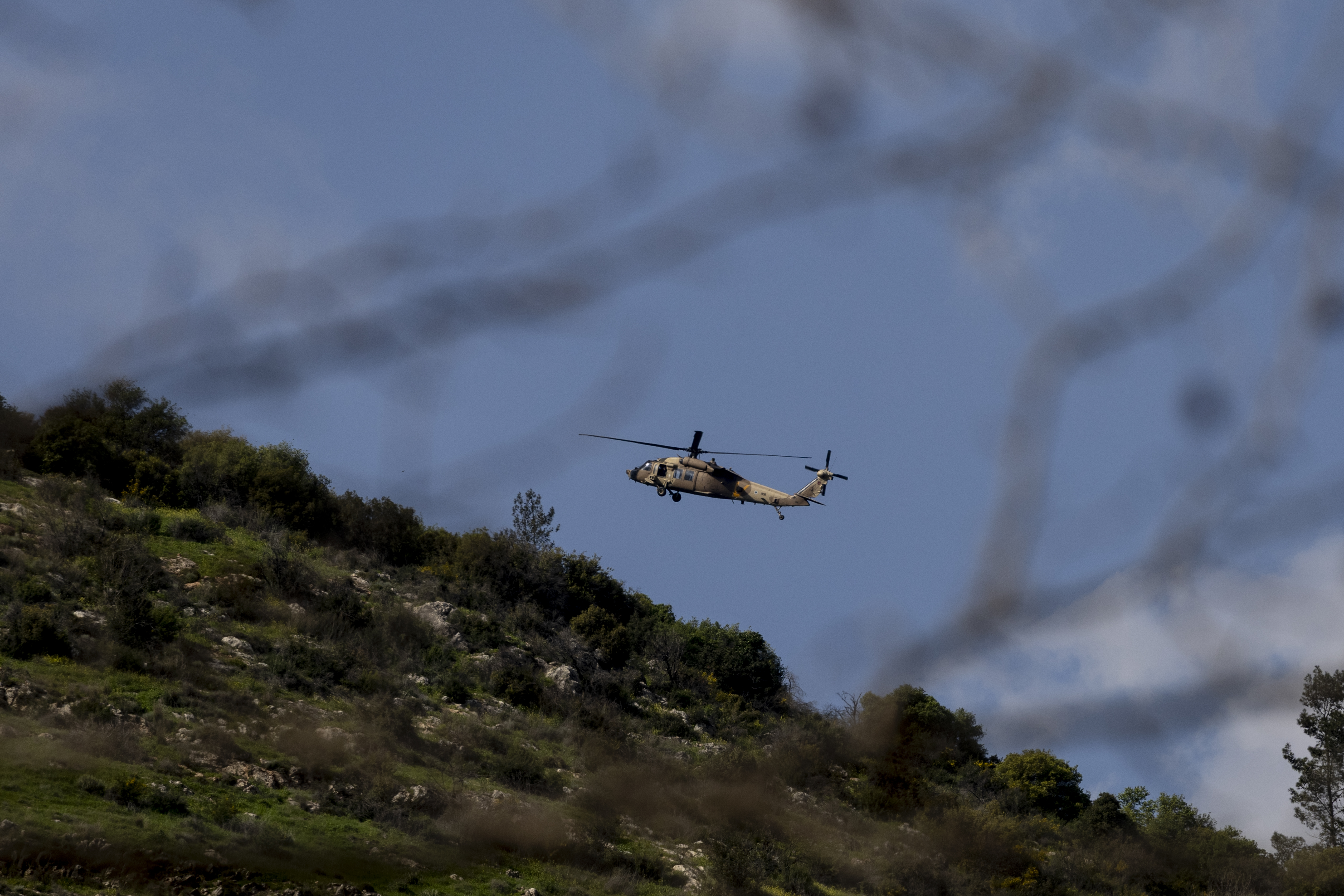 NORTHERN ISRAEL, ISRAEL - MARCH 2: An helicopter flys above the border with Southern Lebanon as seen from a position on the Israeli side of the border on March 2, 2026 near the border with Lebanon in northern Israel. Hezbollah, the Iran-backed militant group in Lebanon, launched missiles at Israel in what it said was retaliation for the joint U.S.-Israeli war on Iran. (Photo by Amir Levy/Getty Images)
