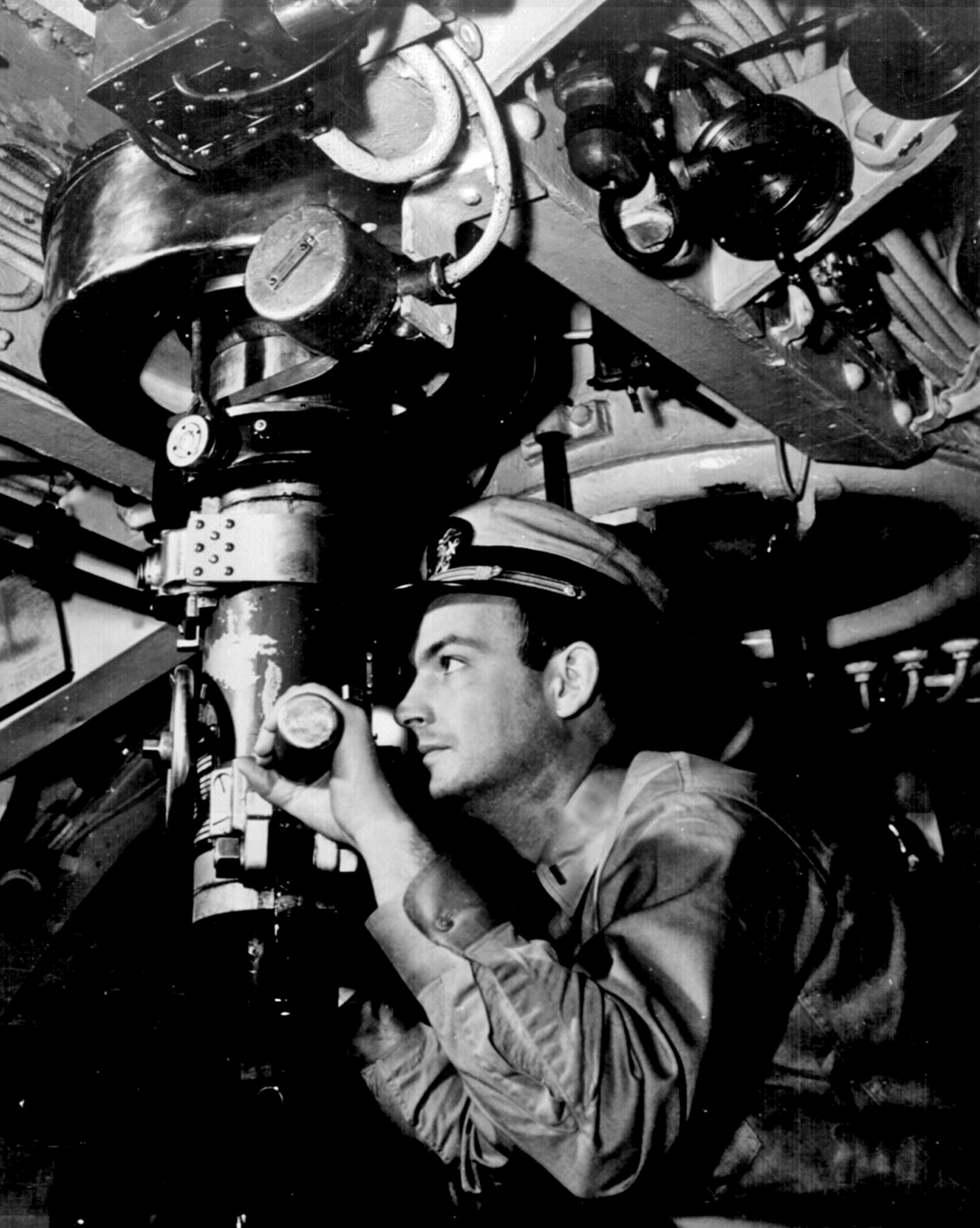 Officer at periscope in control room of submarine in Pacific. 1945. (Photo by JAZZ EDITIONS/Gamma-Rapho via Getty Images)