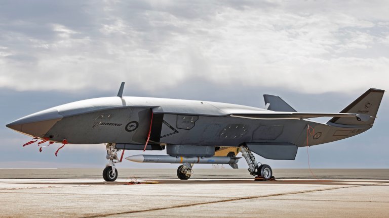 An MQ-28A Ghost Bat loaded with an AIM-120 Advanced Medium Range Air-to-Air Missile during Trial Kareela at RAAF Base Woomera, South Australia.