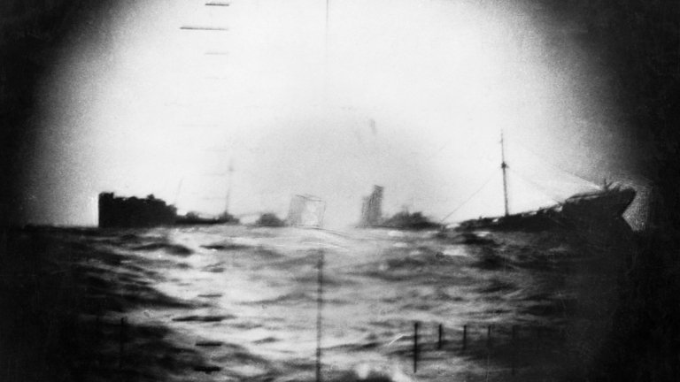 A submarine attack by the USS Thresher (commanded by Commander W.J. Millican) has broken the back of this Japanese ship, hitting amidships. It is about to sink.