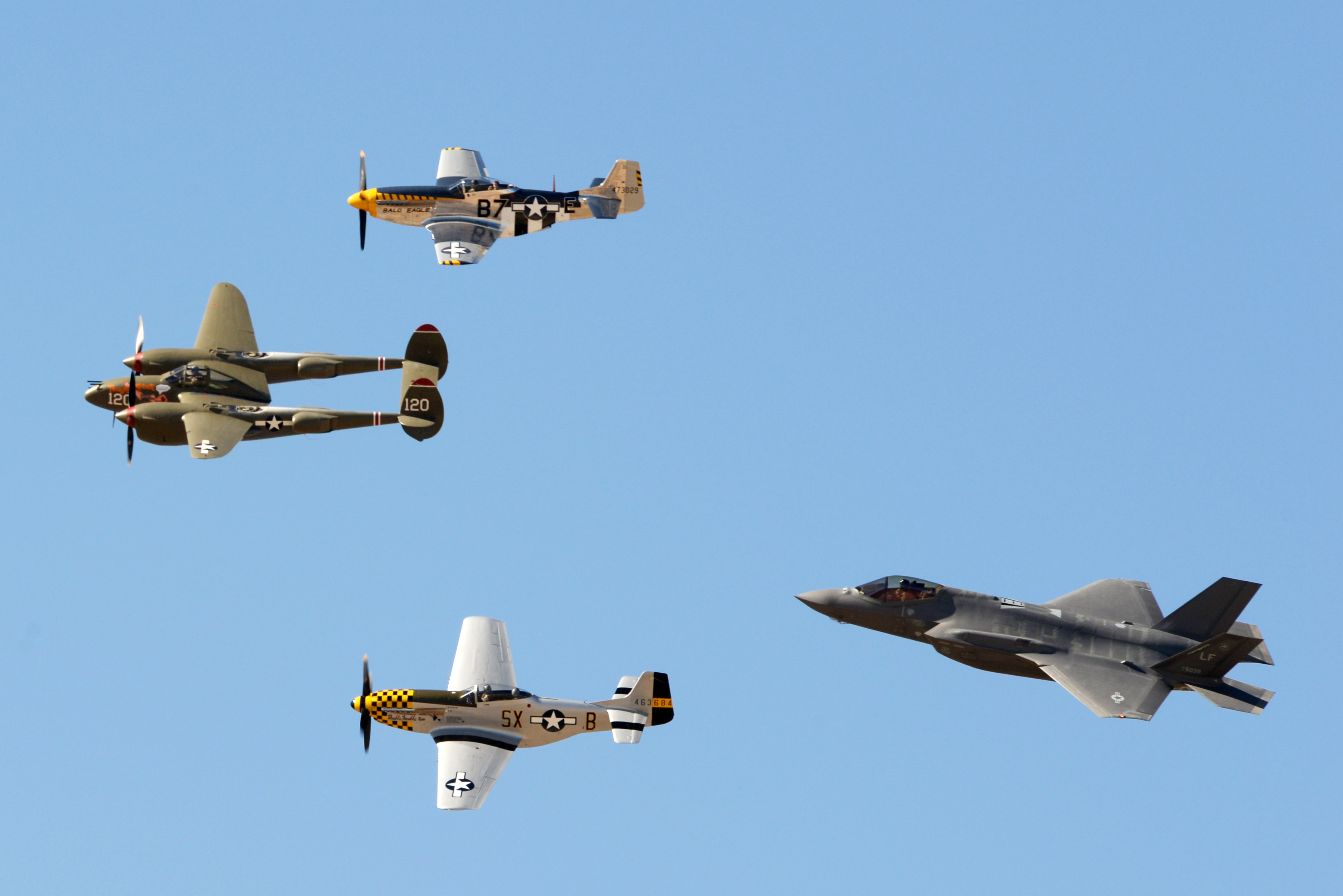 The F-35 Lightning II flies in formation with the P-38 Lightning and two P-51 Mustangs during the Heritage Flight Conference at Davis Monthan Air Force Base in Tucson, Ariz., March 4-6, 2016. The F-35 heritage flight team from Luke Air Force Base, Ariz. is the first F-35 team to participate in the Heritage Flight Program. The program features modern USAF fighter aircraft flying alongside World War II, Korean and Vietnam era aircraft in a dynamic display of our nation's air power history. (U.S. Air Force photo by Staff Sgt. Staci Miller)