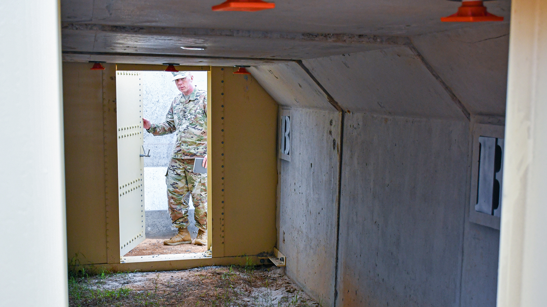 Col. William C. Hannan, Jr., U.S. Army Corps of Engineers Transatlantic Division commander, examines innovative design feature updates on the U.S. Army Central’s Bunker Retrofit project, designed to increase protection for service members throughout the U.S. Central Command’s area of operations, prior to the U.S. Army Engineer Research and Development Center’s Phase II Live-fire Experiment at Fort Polk, La., Mar. 10.